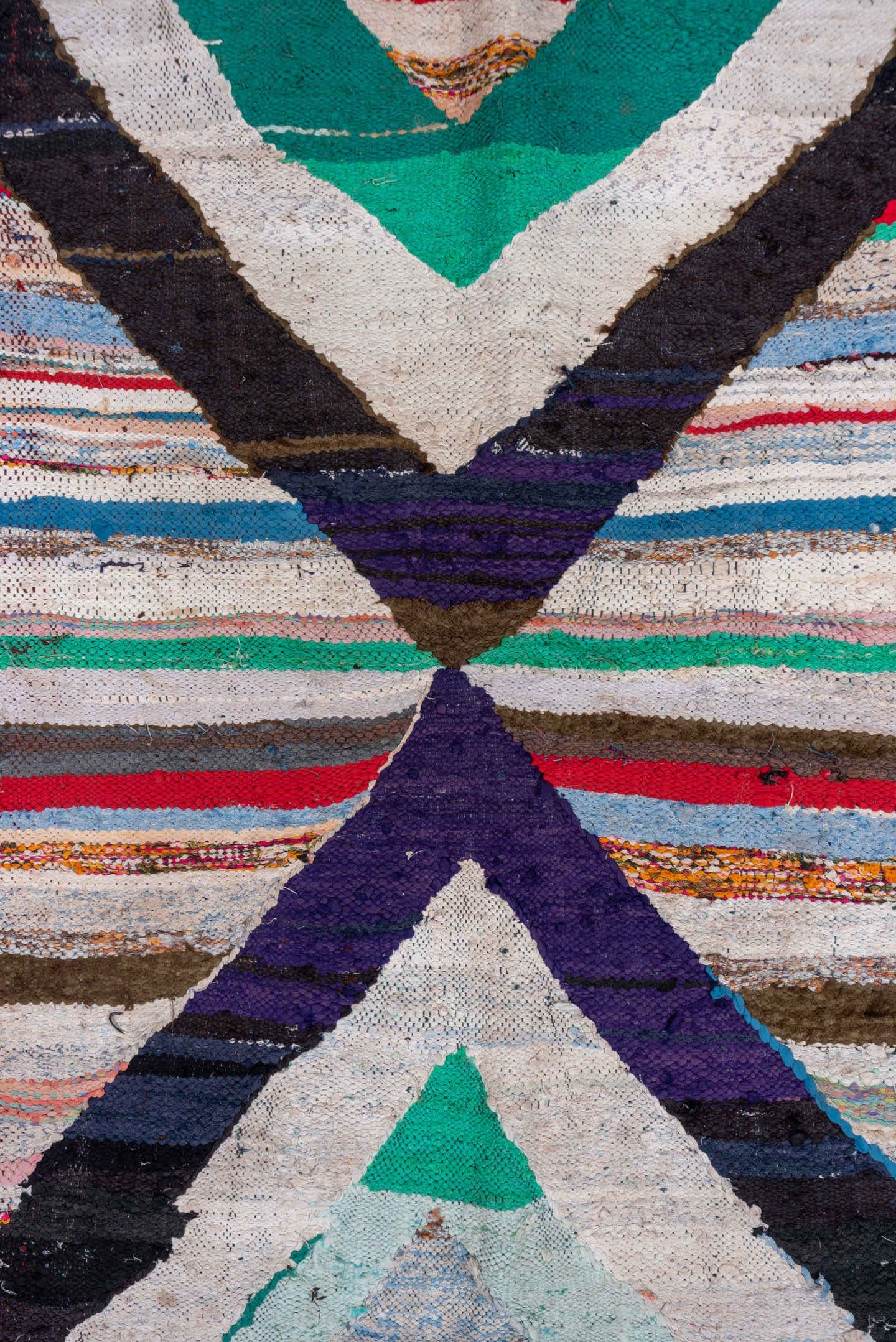 5' x 8' one-of-a-kind handmade vintage Rag Rug medium size rug. Color palette: ivory, black, teal, red, sky_blue, violet