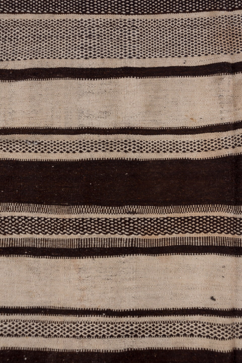 4' x 10' one-of-a-kind handmade vintage Blanket runner rug. Color palette: ivory, espresso, charcoal, taupe, brown, black