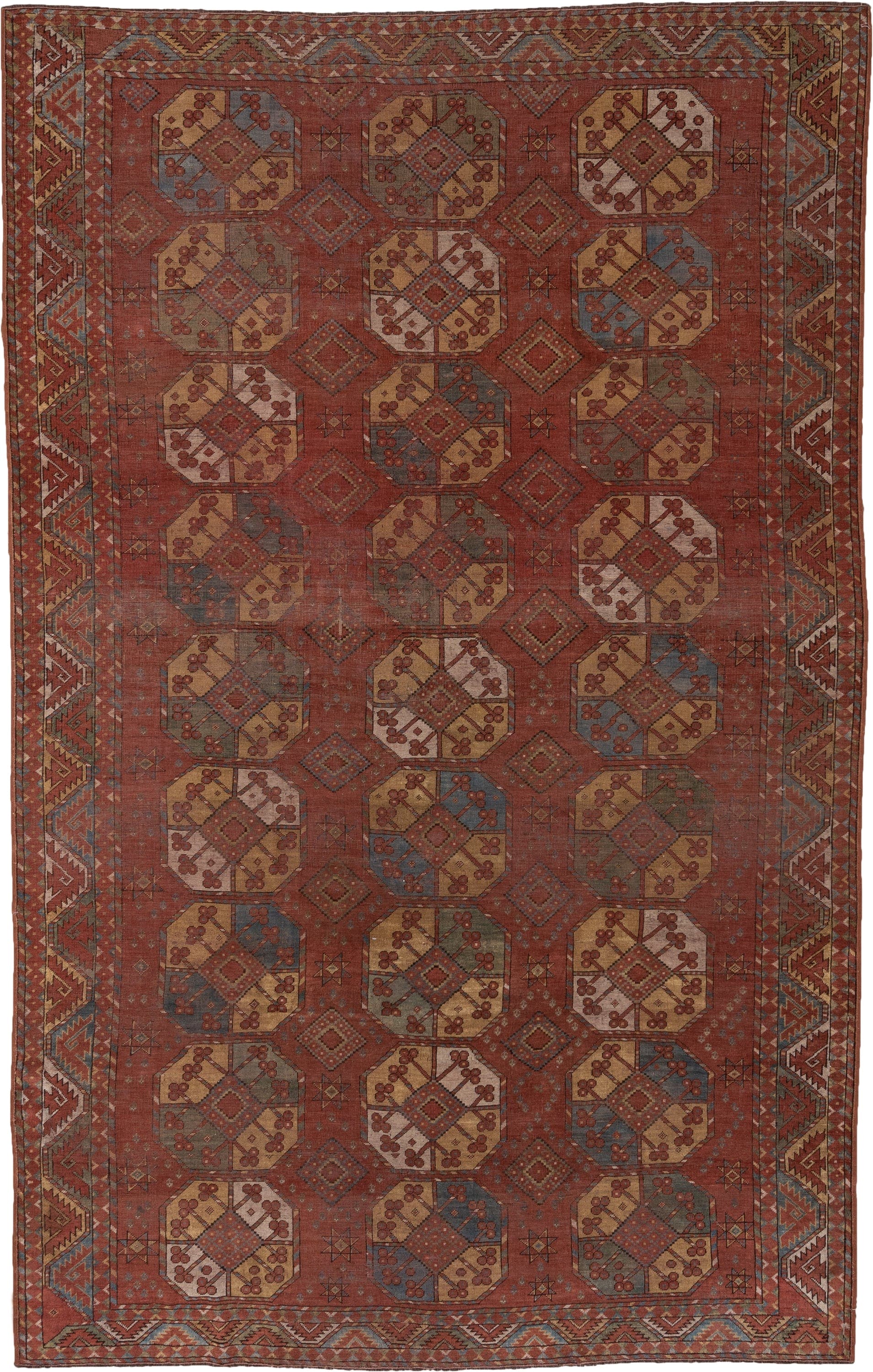 7' x 11' one-of-a-kind handmade antique Afghan large size rug. Color palette: rust, terra cotta, camel, ivory, slate blue