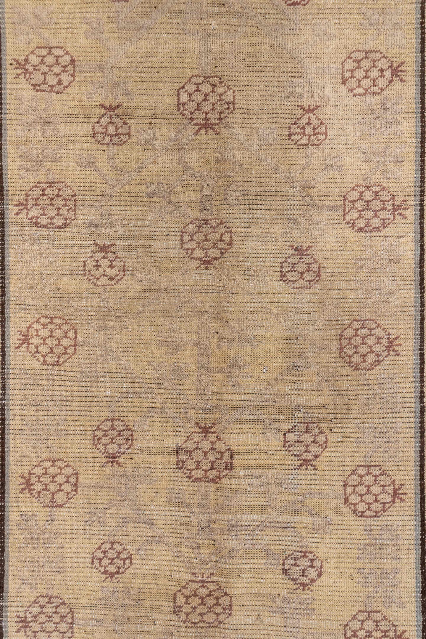 4' x 8' one-of-a-kind handmade vintage Khotan rug. Color palette: ivory, taupe, brown, camel, rose, slate, beige, gray, pink
