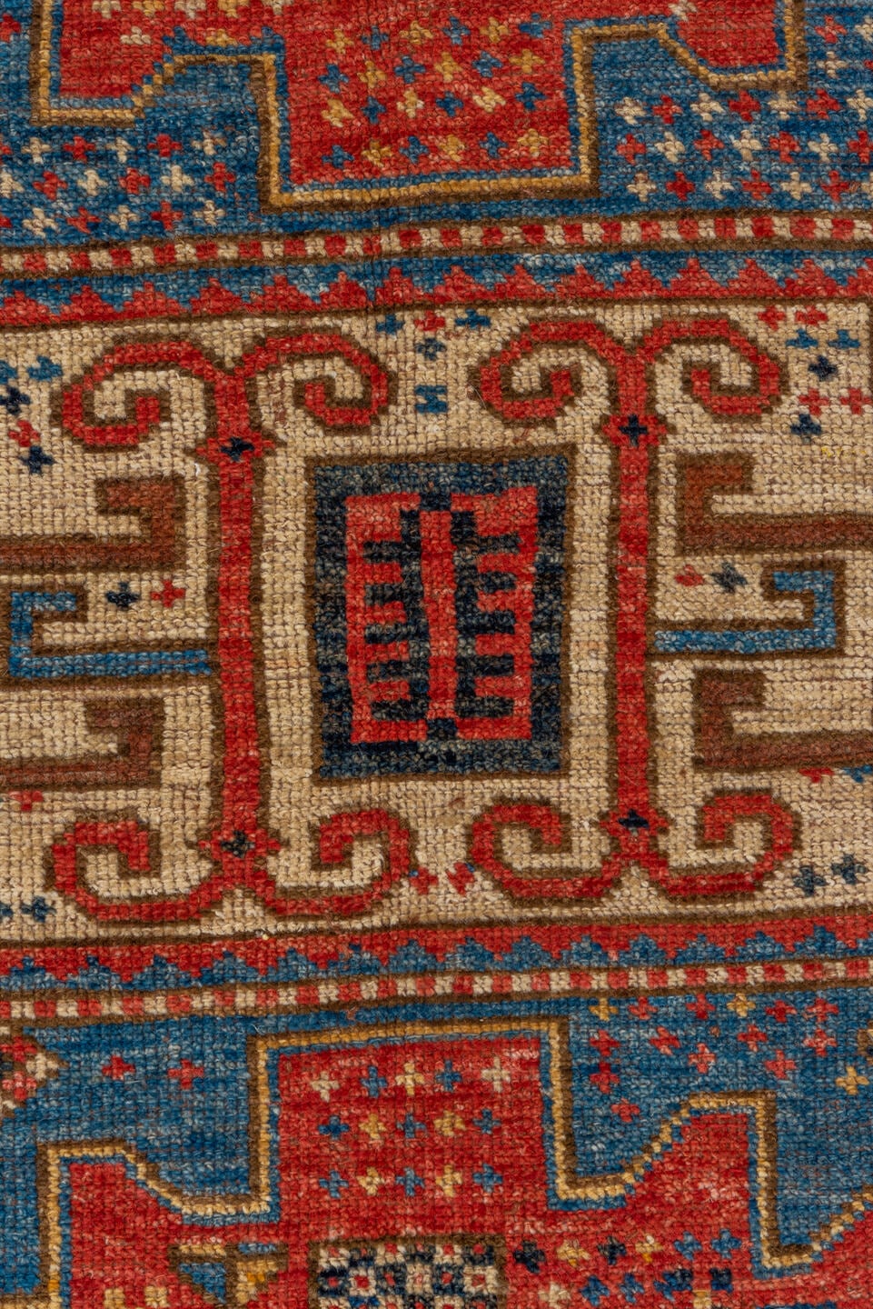 4' x 6' one-of-a-kind handmade vintage Kazak small size rug. Color palette: blue, ivory, red, camel, navy, brown, black