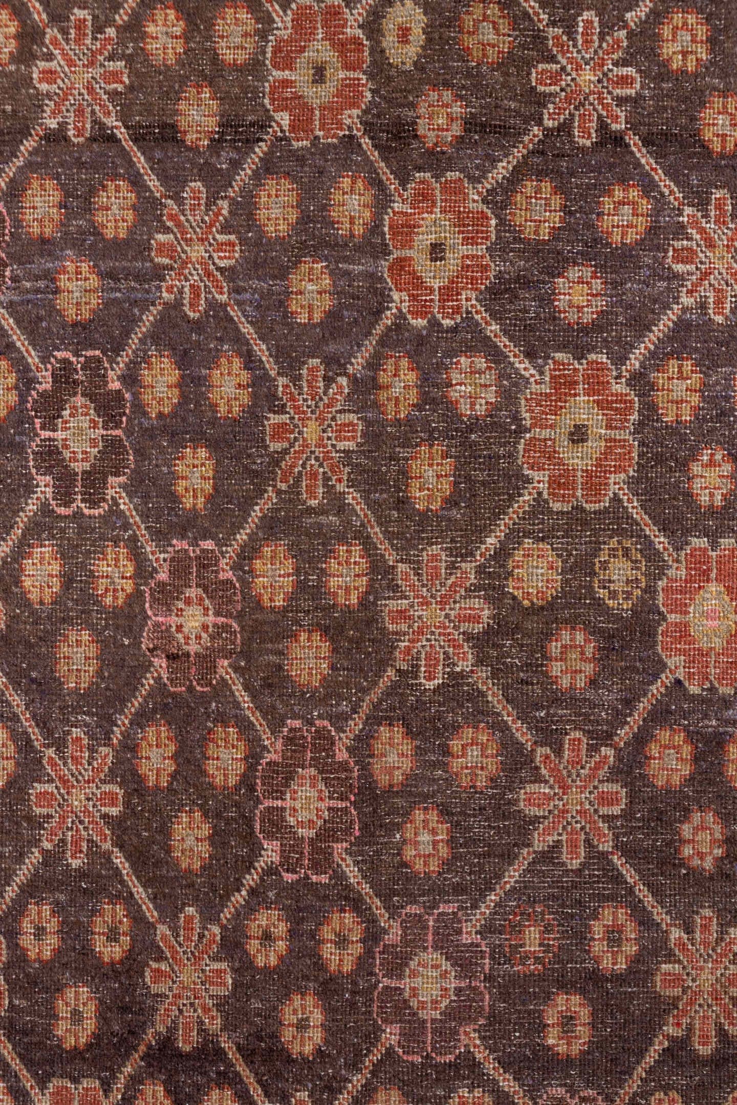 4' x 8' one-of-a-kind handmade vintage Khotan rug. Color palette: brown, rust, camel, ivory, rose, blue, charcoal