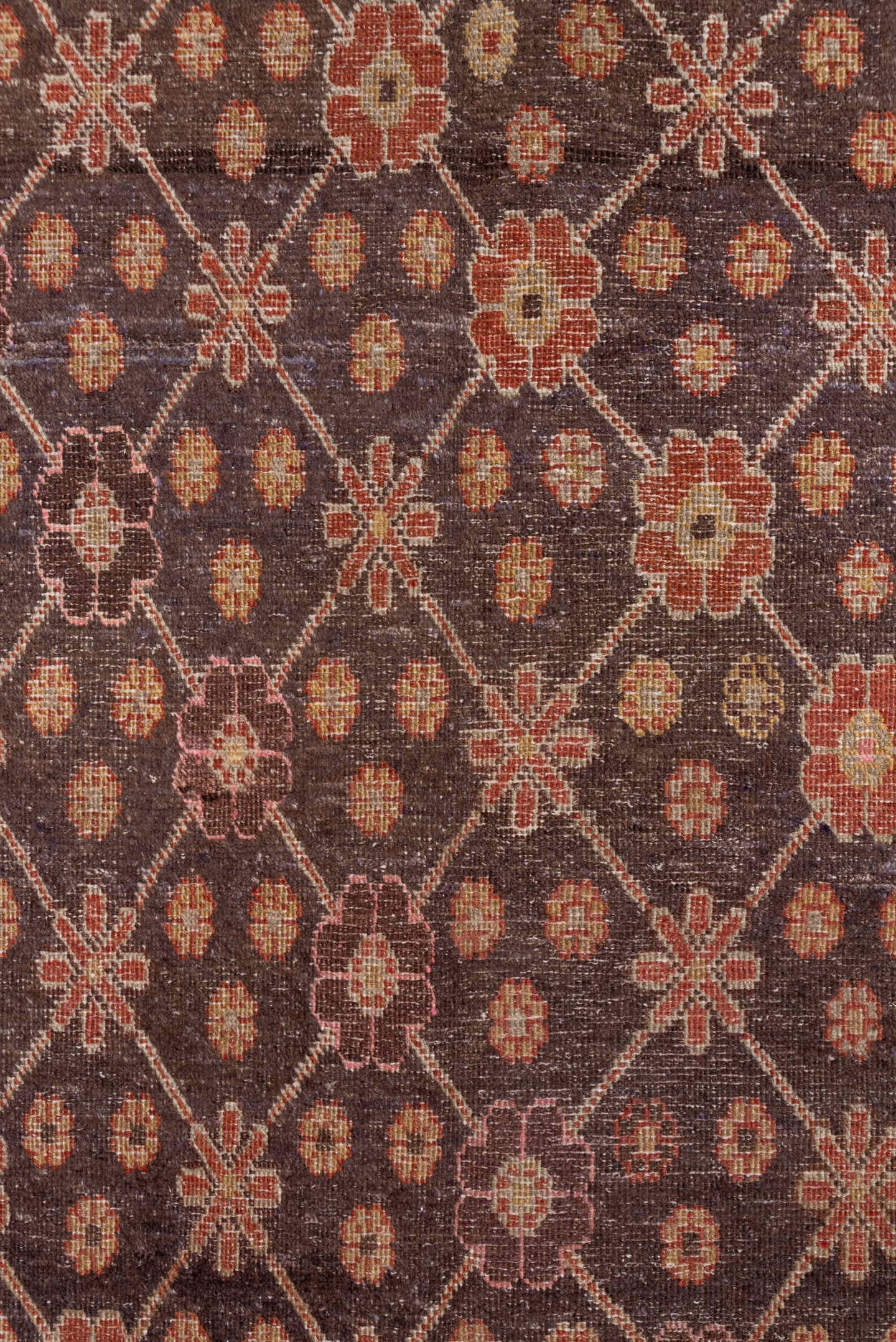 4' x 8' one-of-a-kind handmade vintage Khotan rug. Color palette: brown, rust, camel, ivory, rose, blue, charcoal