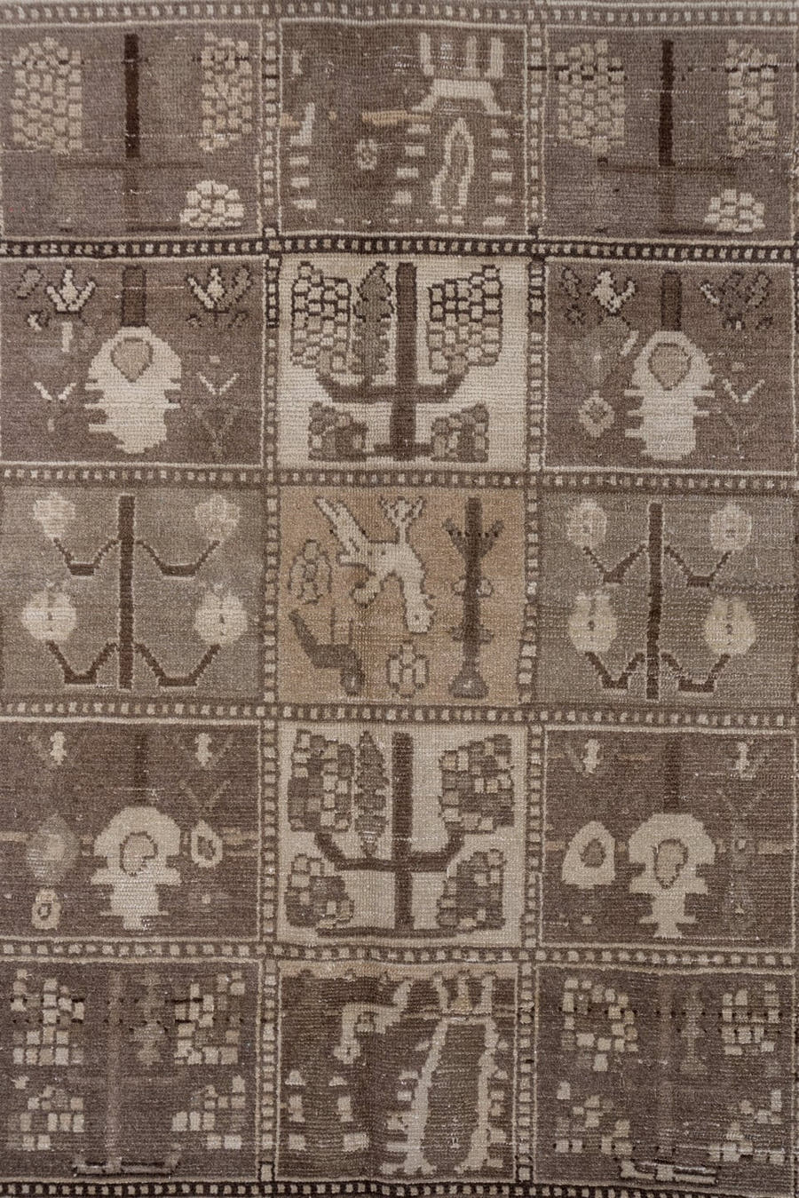 5' x 9' one-of-a-kind handmade antique Baktiary medium size rug. Color palette: taupe, brown, ivory, charcoal, camel, beige