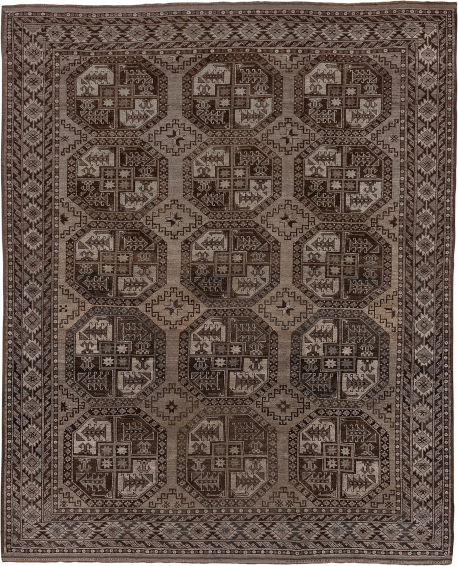 7' x 9' one-of-a-kind handmade antique Afghan rug. Color palette: brown, taupe, ivory, charcoal, camel, slate, beige, gray