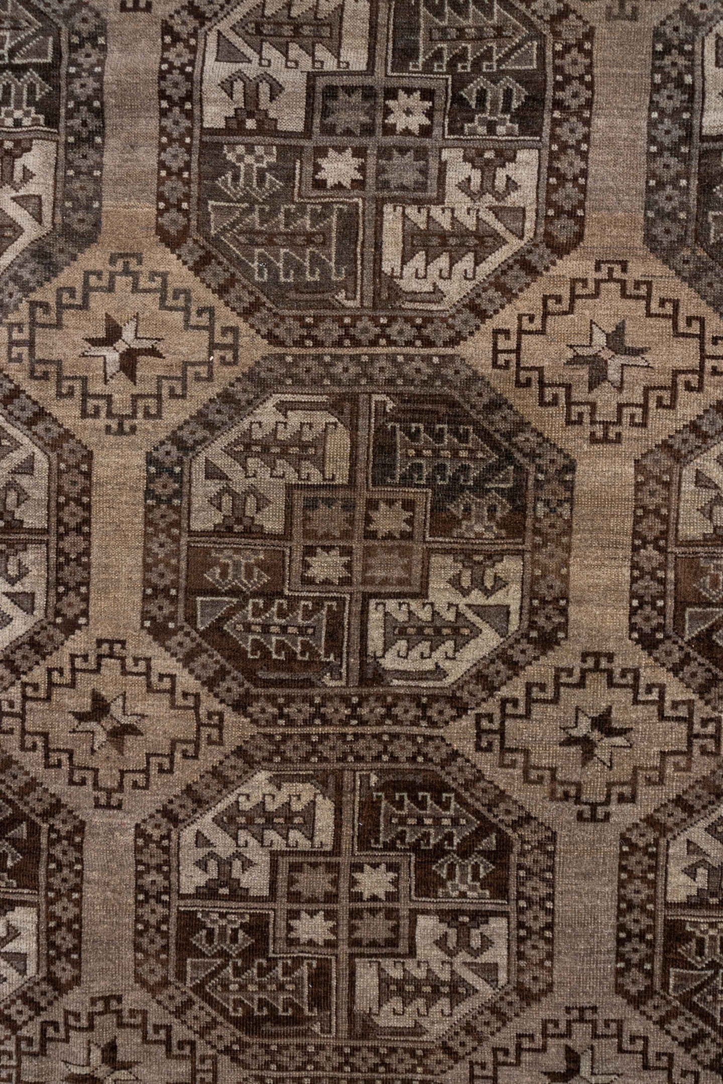 7' x 9' one-of-a-kind handmade antique Afghan rug. Color palette: brown, taupe, ivory, charcoal, camel, slate, beige, gray