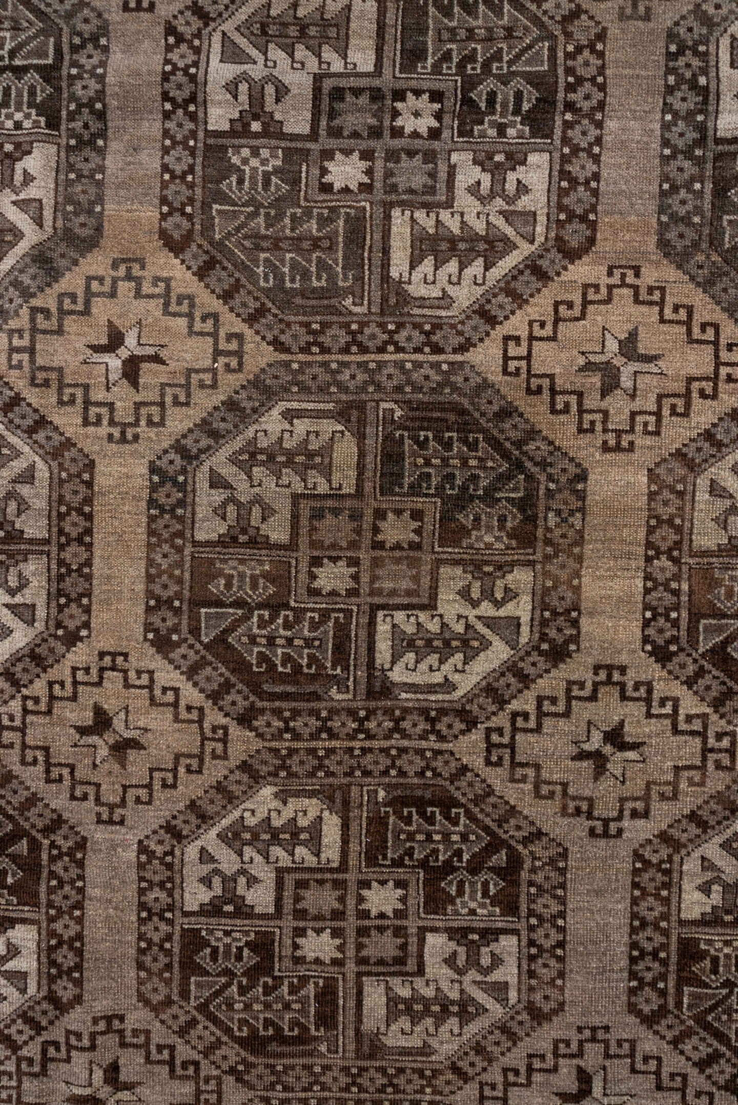 7' x 9' one-of-a-kind handmade antique Afghan rug. Color palette: brown, taupe, ivory, charcoal, camel, slate, beige, gray