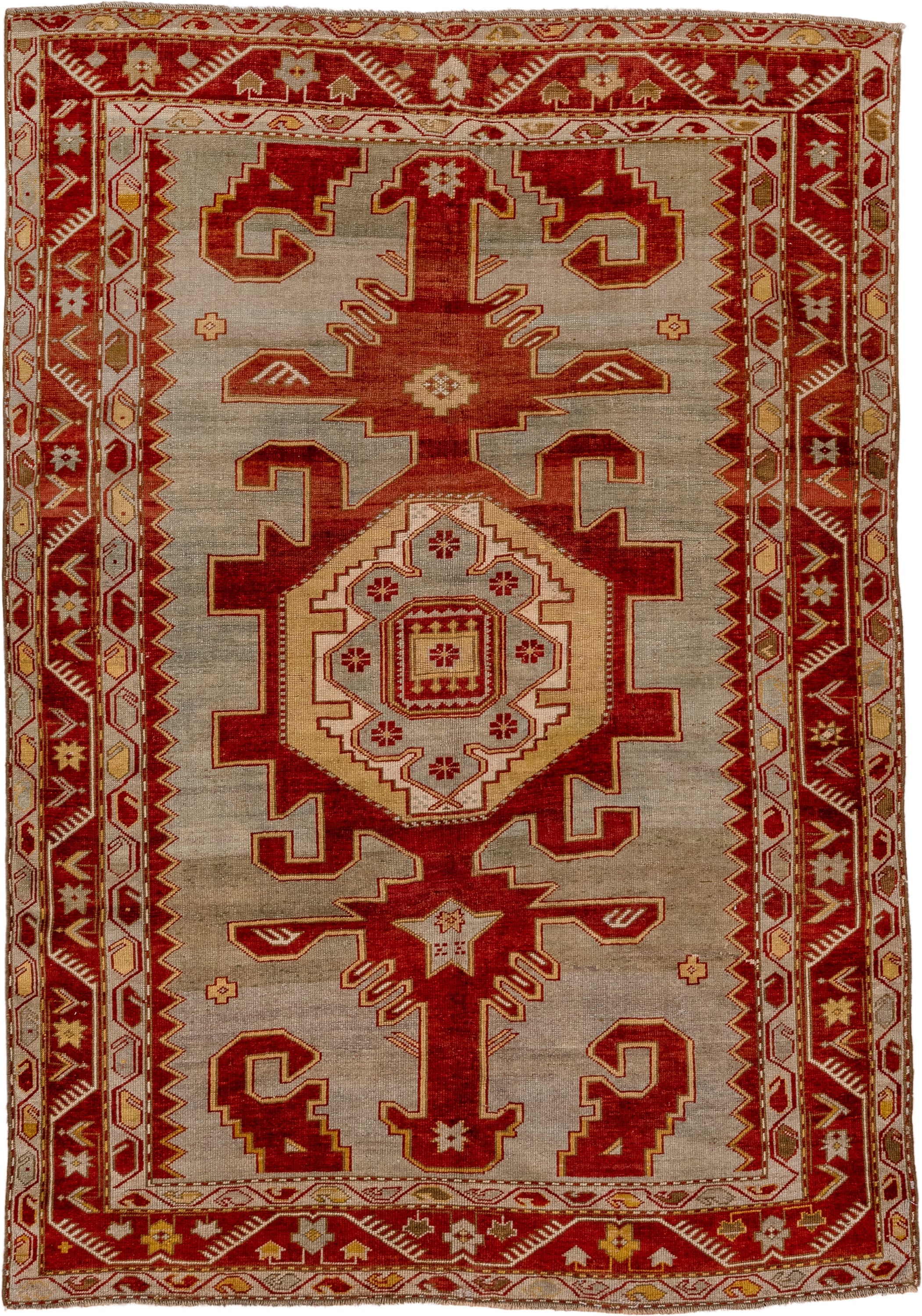 4' x 6' one-of-a-kind handmade antique Caucasian rug. Color palette: ivory, rust, crimson, camel, gold, taupe, terracotta