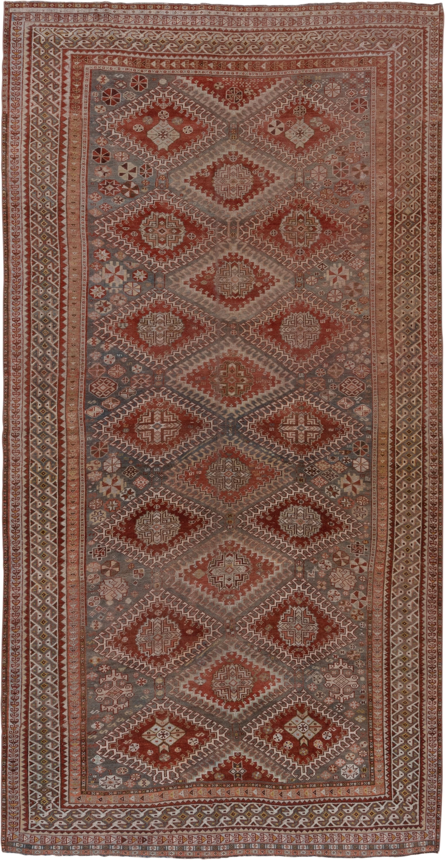 6' x 12' one-of-a-kind handmade antique Shiraz large size rug. Color palette: rust, blue_gray, ivory, taupe, terra_cotta