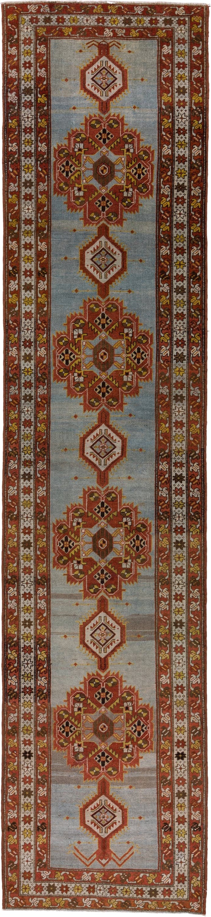 3' x 14' one-of-a-kind handmade antique Heriz runner rug. Color palette: rust, light blue, ivory, gold, brown, charcoal