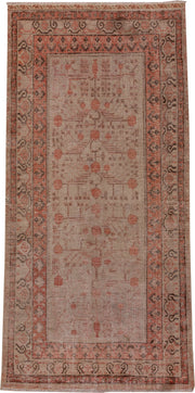 5' x 11' one-of-a-kind handmade antique Khotan rug. Color palette: ivory, terra cotta, taupe, charcoal, rose, camel