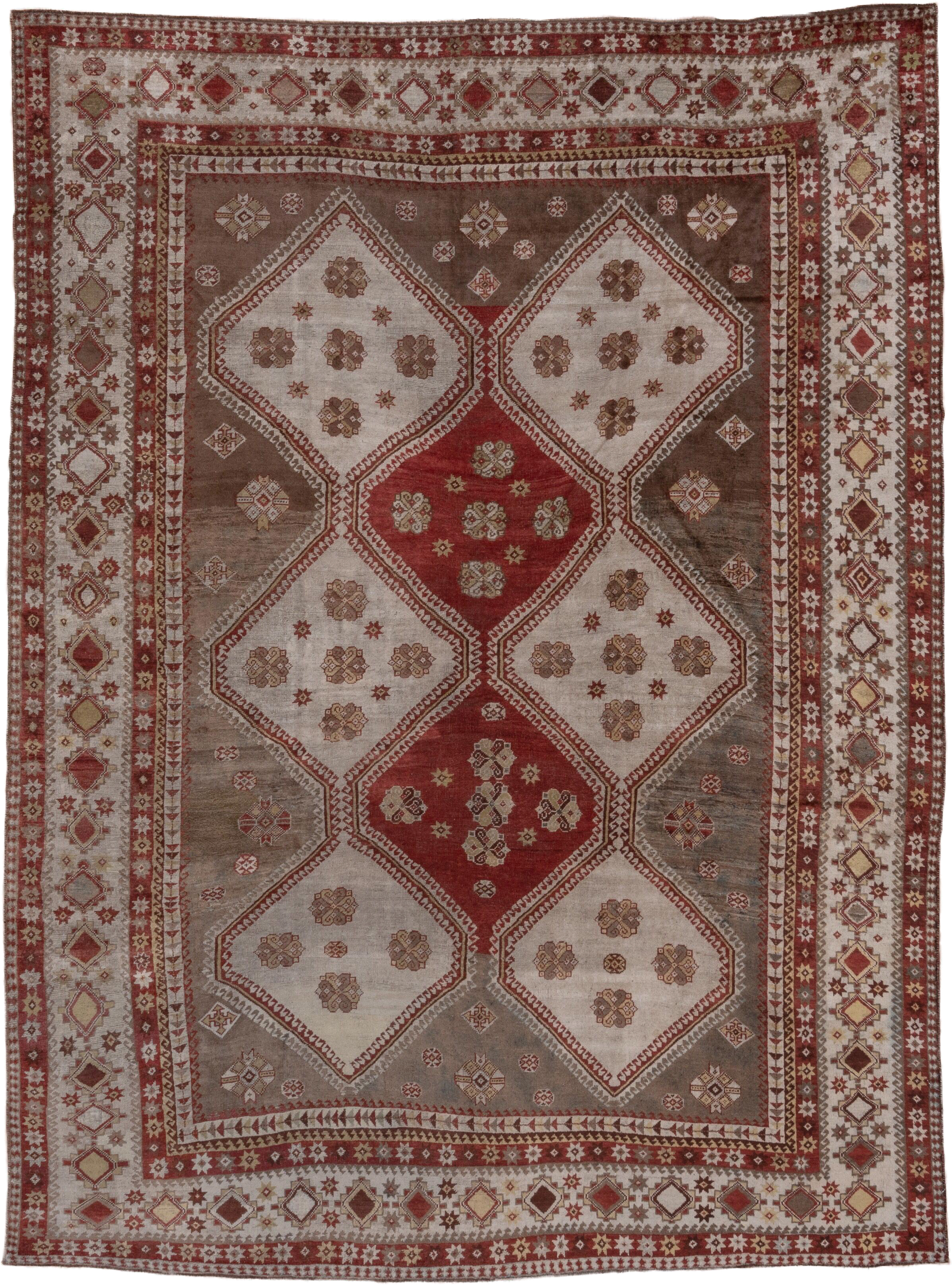 7' x 10' one-of-a-kind handmade antique Shiraz large size rug. Color palette: rust, ivory, taupe, brown, terracotta, camel