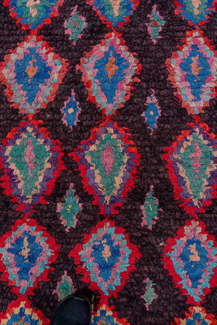 3' x 10' one-of-a-kind handmade vintage Rag Rug runner rug. Color palette: charcoal, crimson, turquoise, lavender, coral