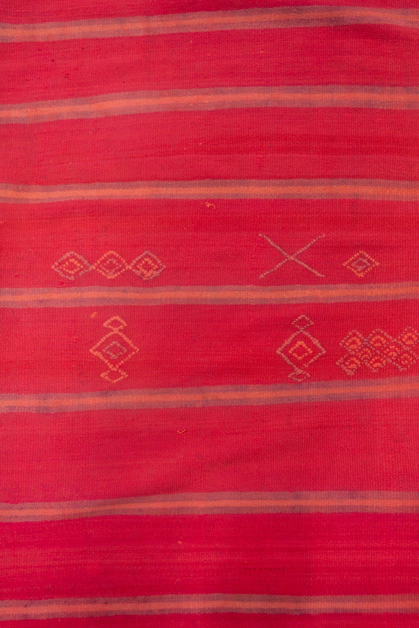 5' x 12' one-of-a-kind handmade vintage Blanket rug. Color palette: rose, crimson, terra cotta, taupe, plum, pink, red