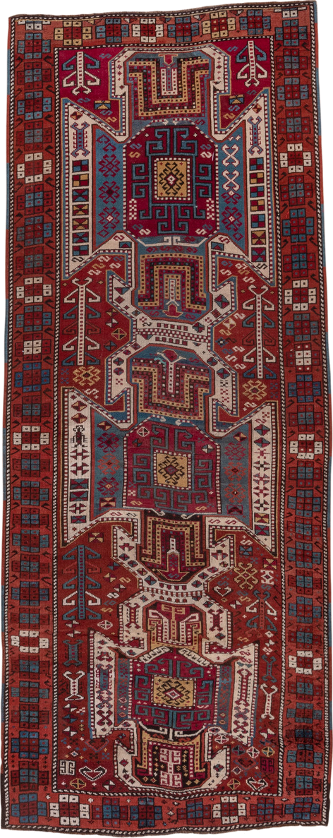 4' x 10' one-of-a-kind handmade antique Caucasian runner rug. Color palette: rust, ivory, indigo, crimson, sky_blue, gold