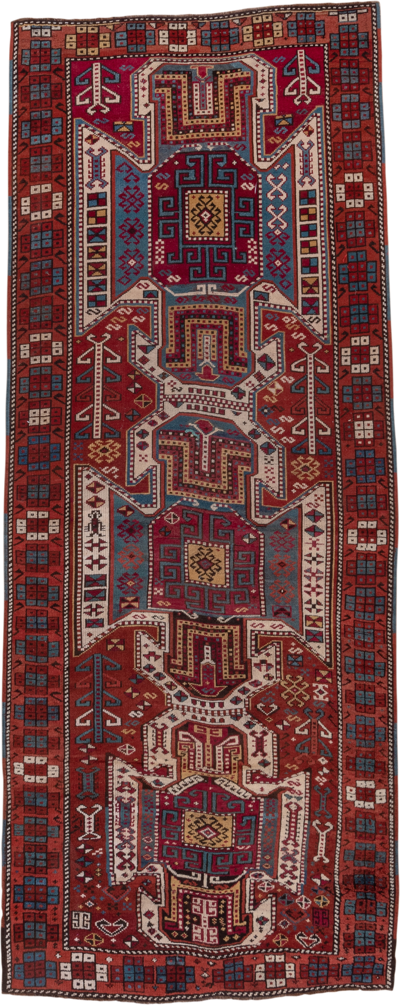 4' x 10' one-of-a-kind handmade antique Caucasian runner rug. Color palette: rust, ivory, indigo, crimson, sky_blue, gold