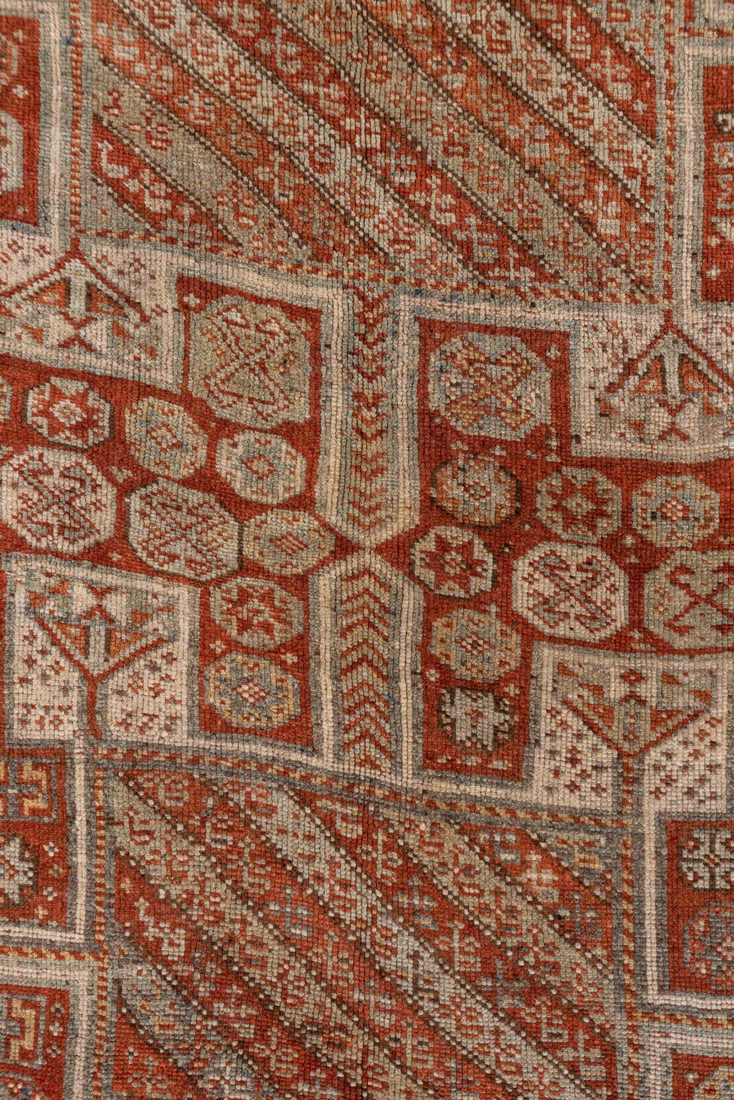 4' x 7' one-of-a-kind handmade antique Kurd rug. Color palette: rust, ivory, terra cotta, brown, taupe, charcoal, terracotta