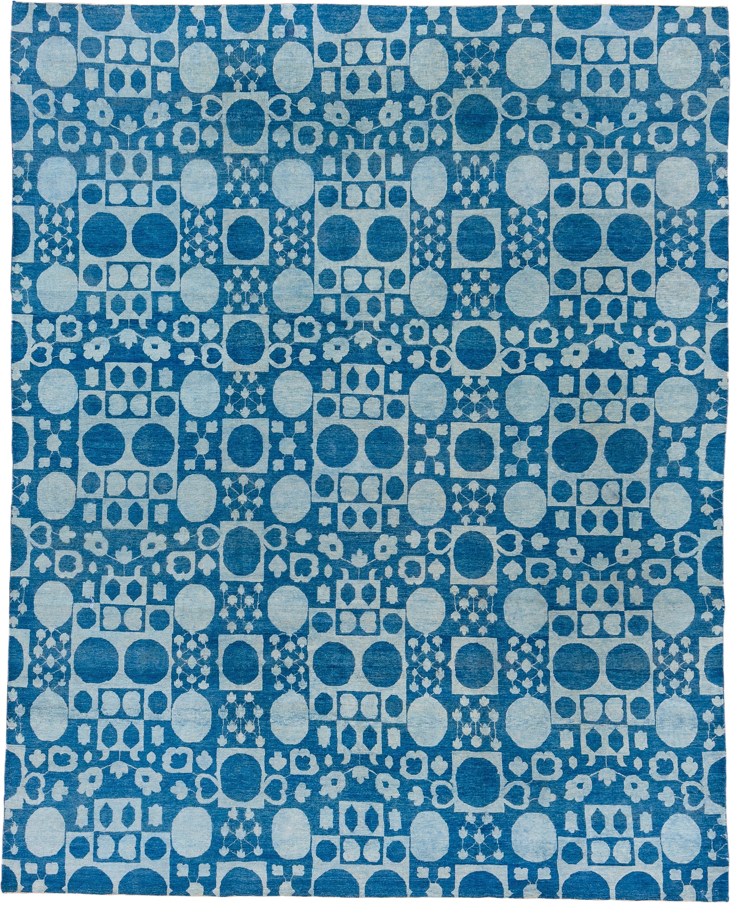 8' x 9' one-of-a-kind handmade handmade Modern rug. Color palette: blue, ivory, sky blue, light blue