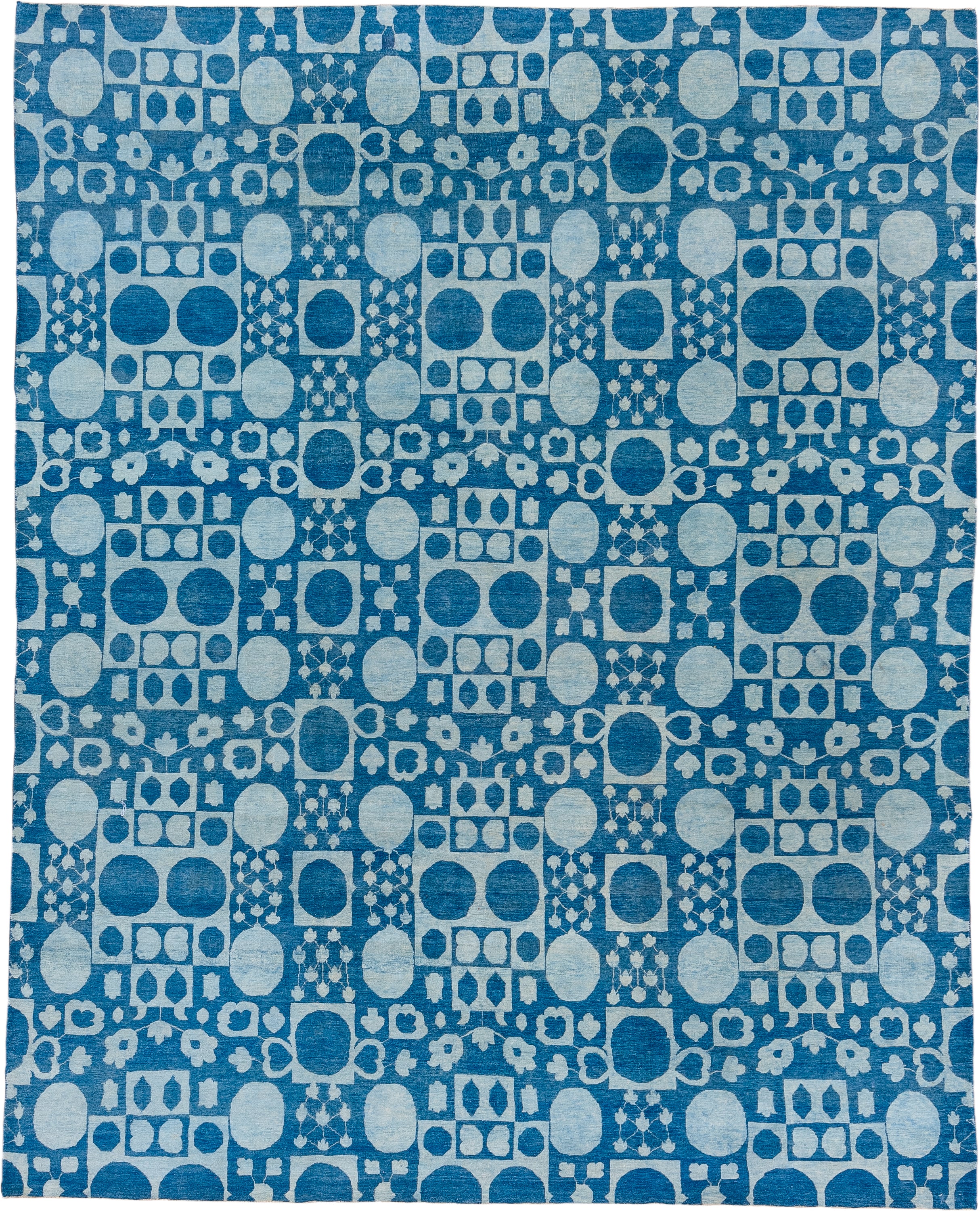 8' x 9' one-of-a-kind handmade handmade Modern rug. Color palette: blue, ivory, sky blue, light blue
