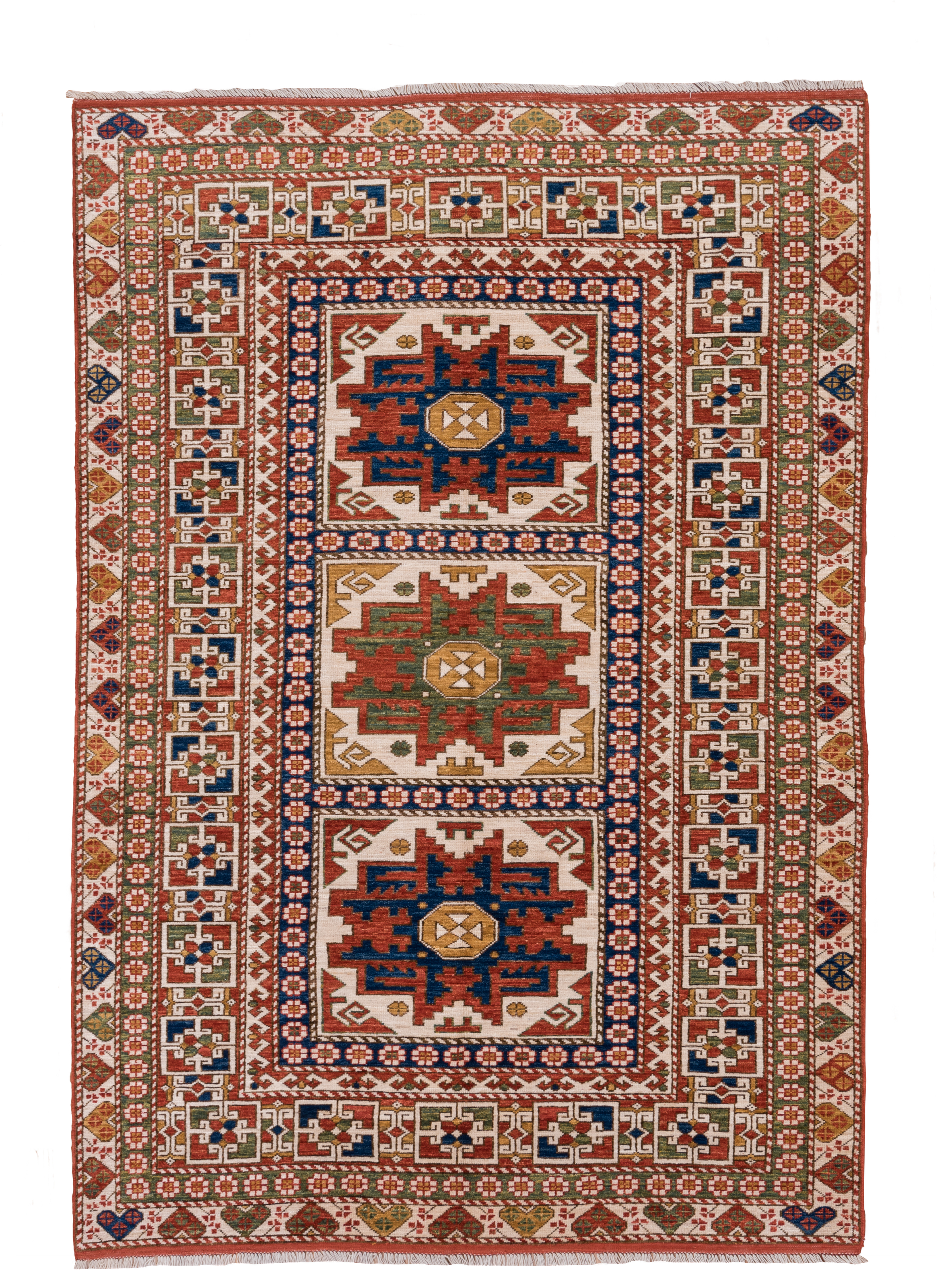 4' x 7' one-of-a-kind handmade vintage Kazak rug. Color palette: ivory, rust, indigo, olive, gold, terra cotta, terracotta