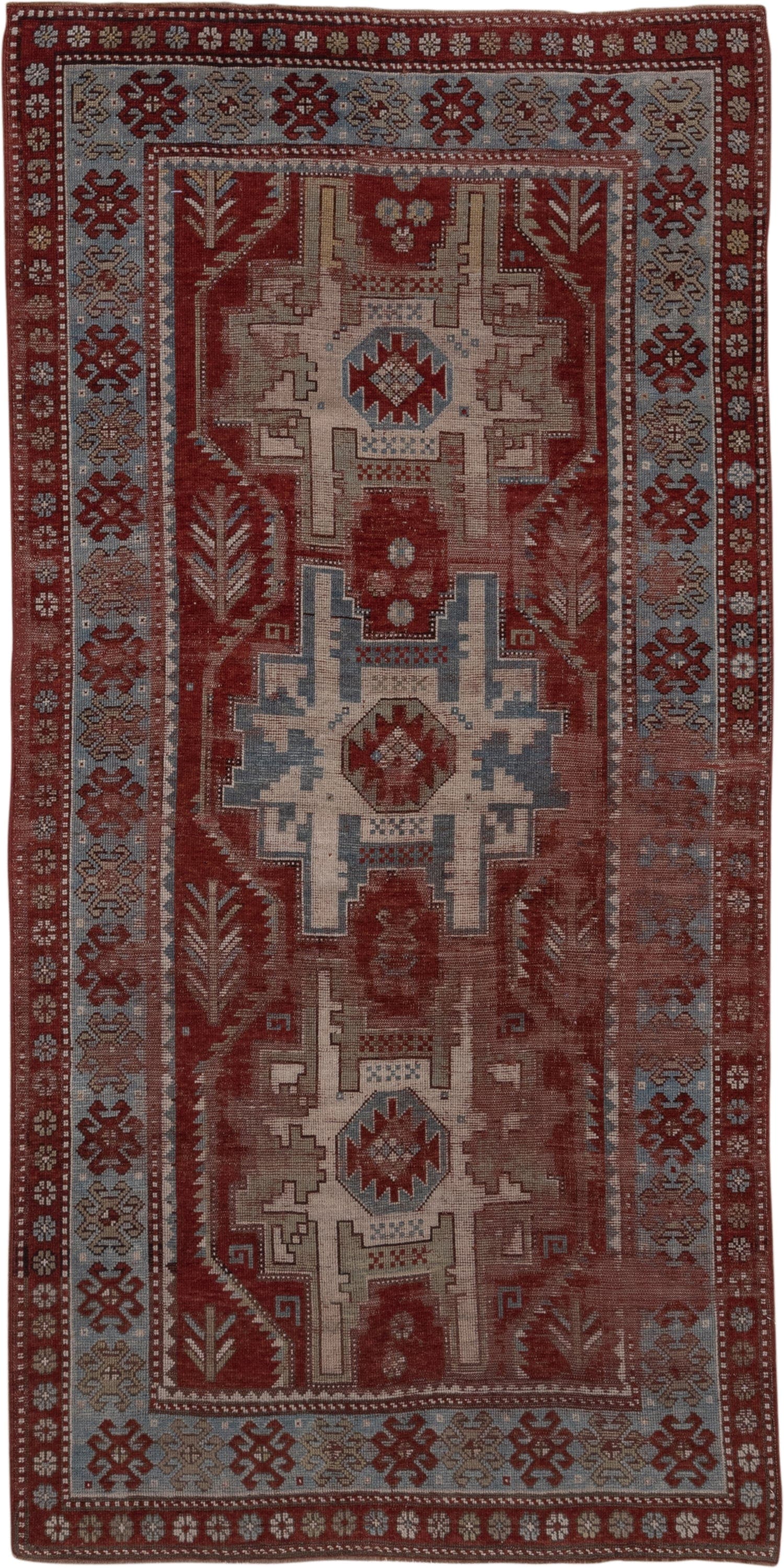 4' x 9' one-of-a-kind handmade antique Kazak runner rug. Color palette: rust, ivory, soft blue, brick, taupe, burgundy