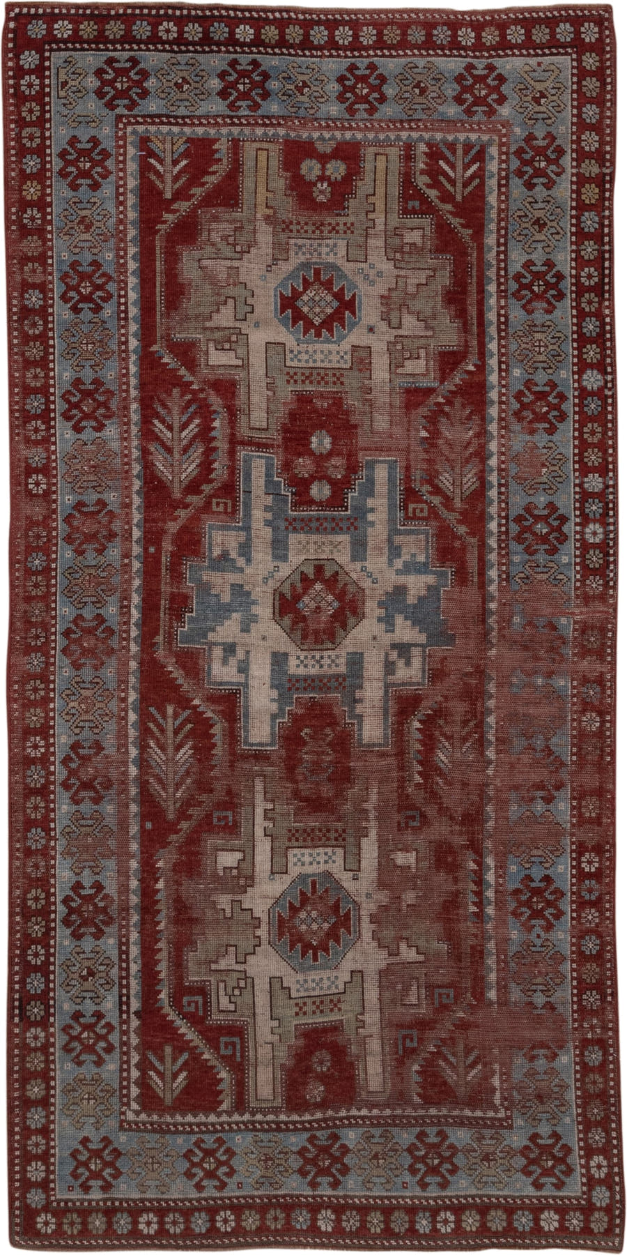 4' x 9' one-of-a-kind handmade antique Kazak runner rug. Color palette: rust, ivory, soft blue, brick, taupe, burgundy