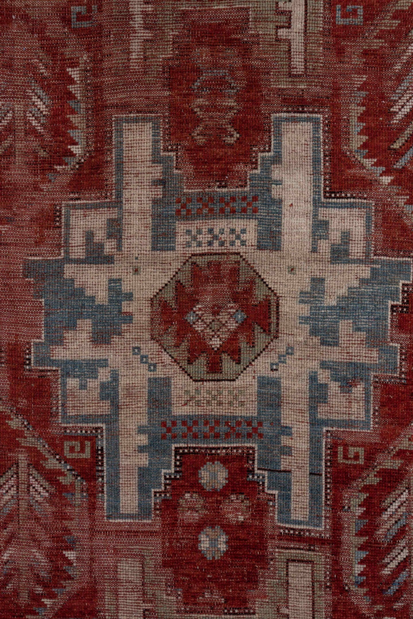 4' x 9' one-of-a-kind handmade antique Kazak runner rug. Color palette: rust, ivory, soft blue, brick, taupe, burgundy