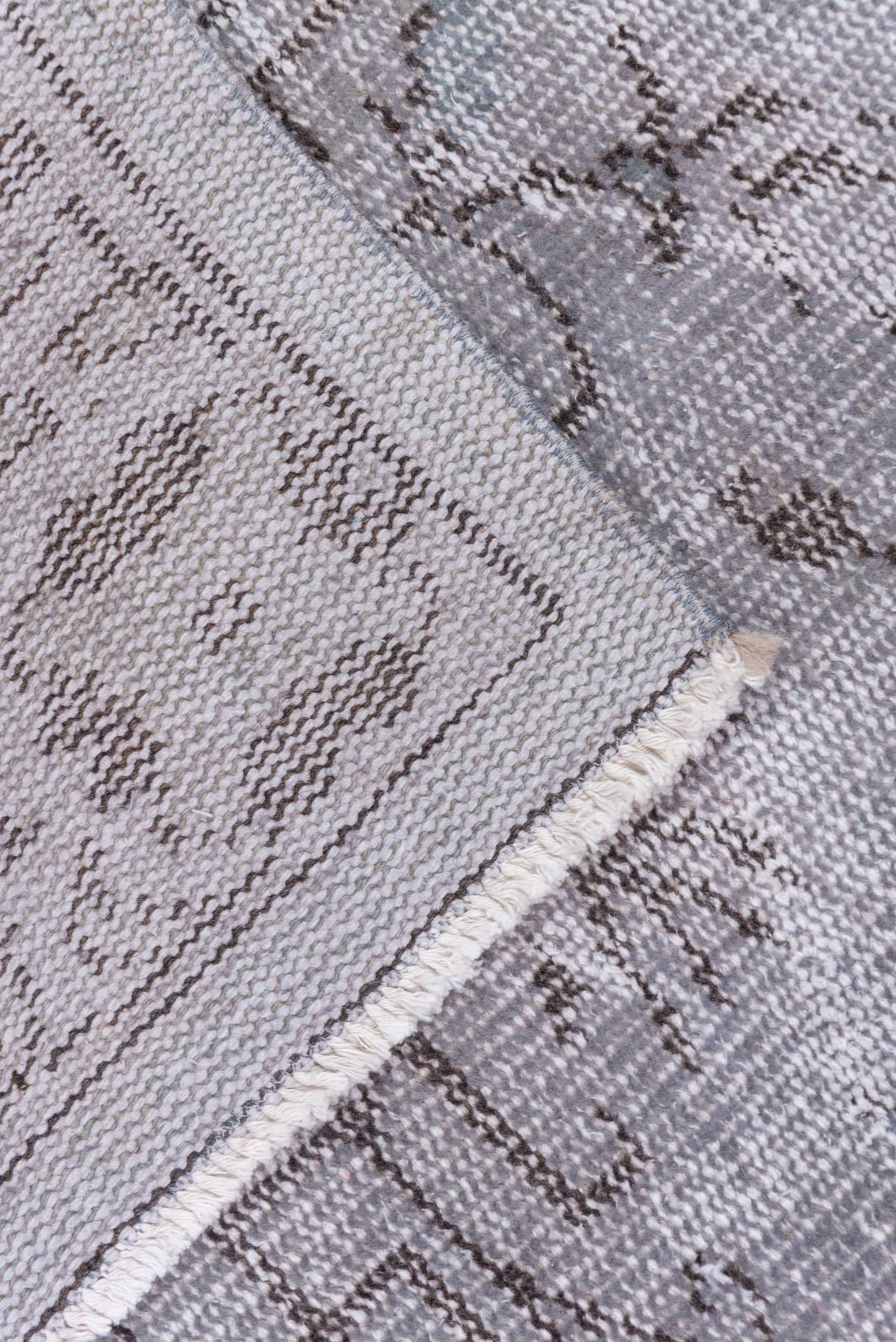 5' x 9' one-of-a-kind handmade vintage Overdyed medium size rug. Color palette: gray, taupe, charcoal, ivory, beige, black