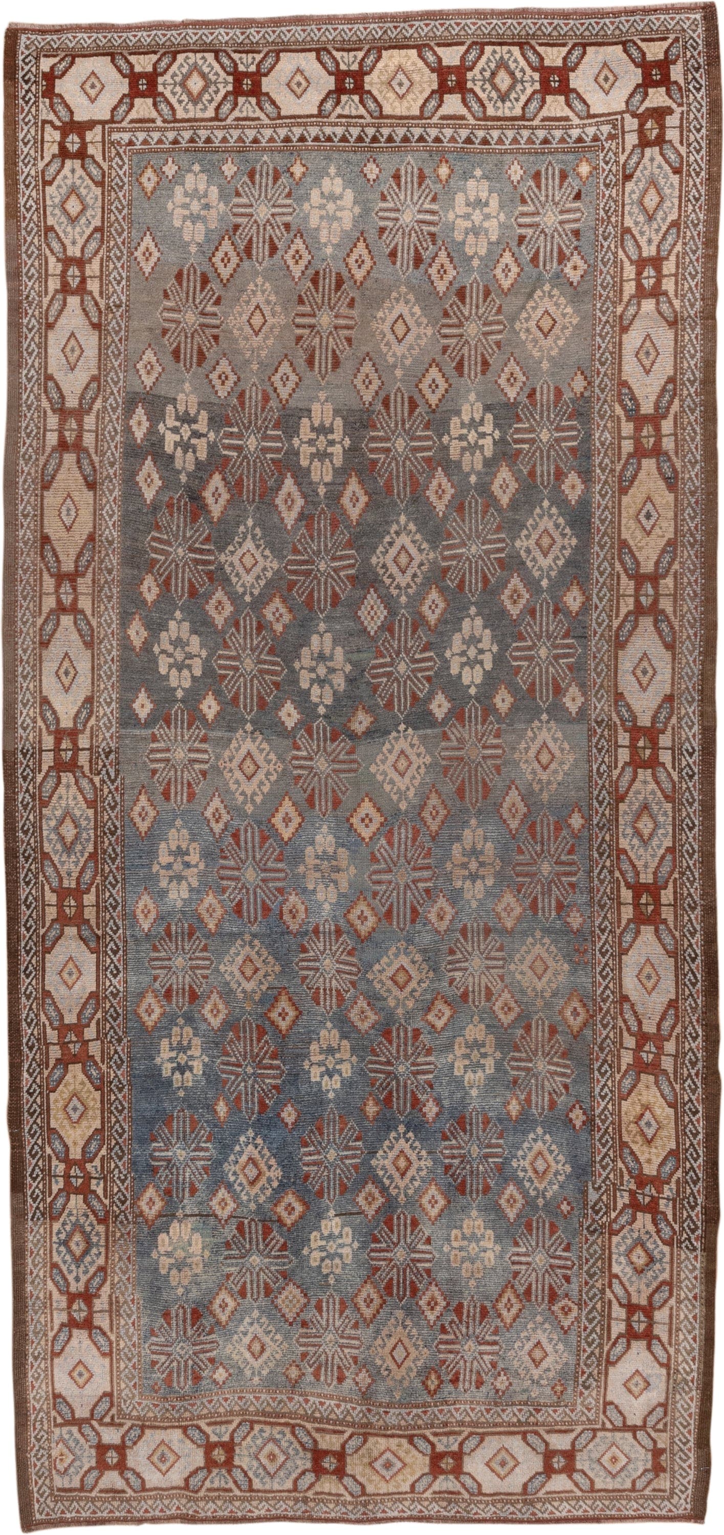 4' x 9' one-of-a-kind handmade antique Caucasian runner rug. Color palette: blue, ivory, rust, taupe, slate, camel