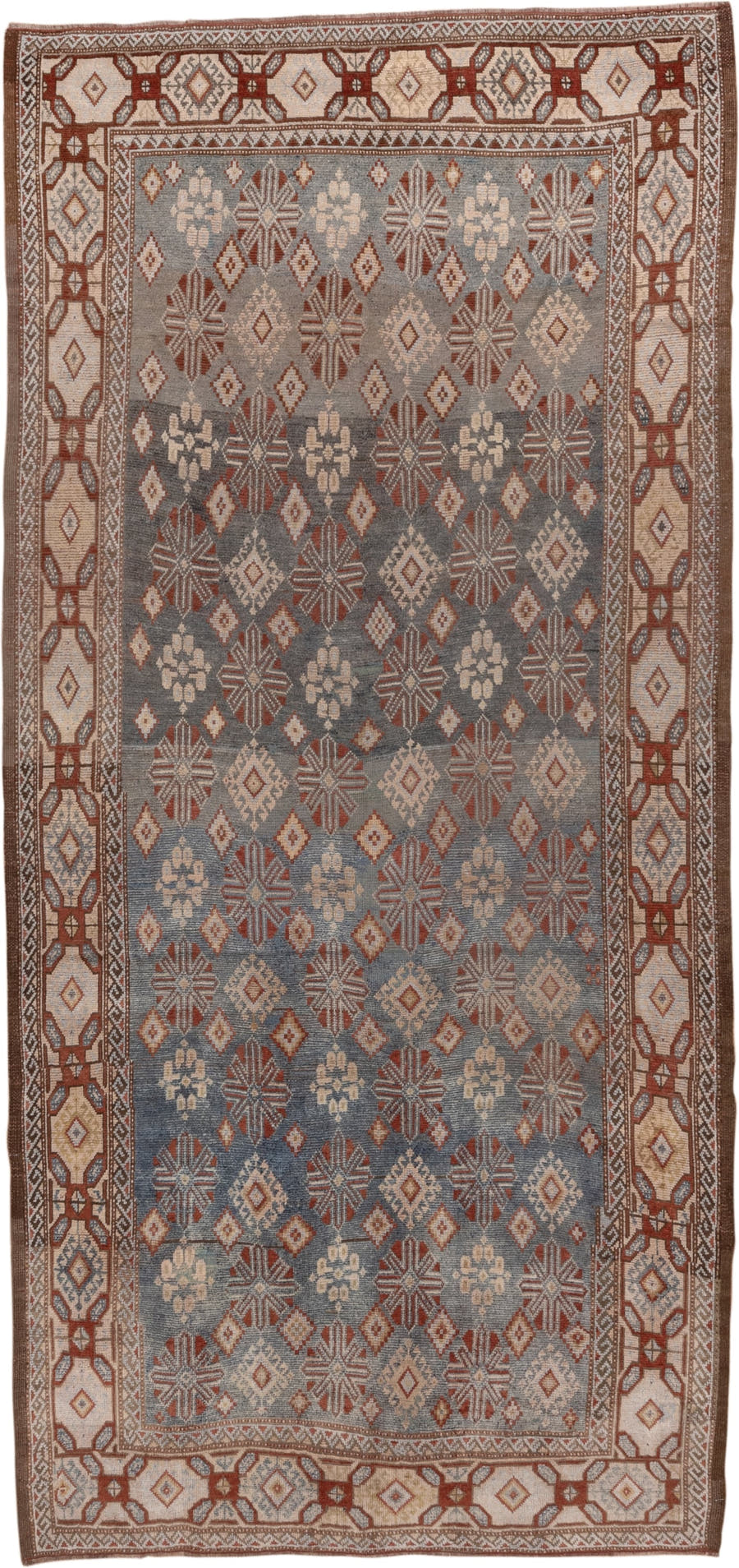 4' x 9' one-of-a-kind handmade antique Caucasian runner rug. Color palette: blue, ivory, rust, taupe, slate, camel