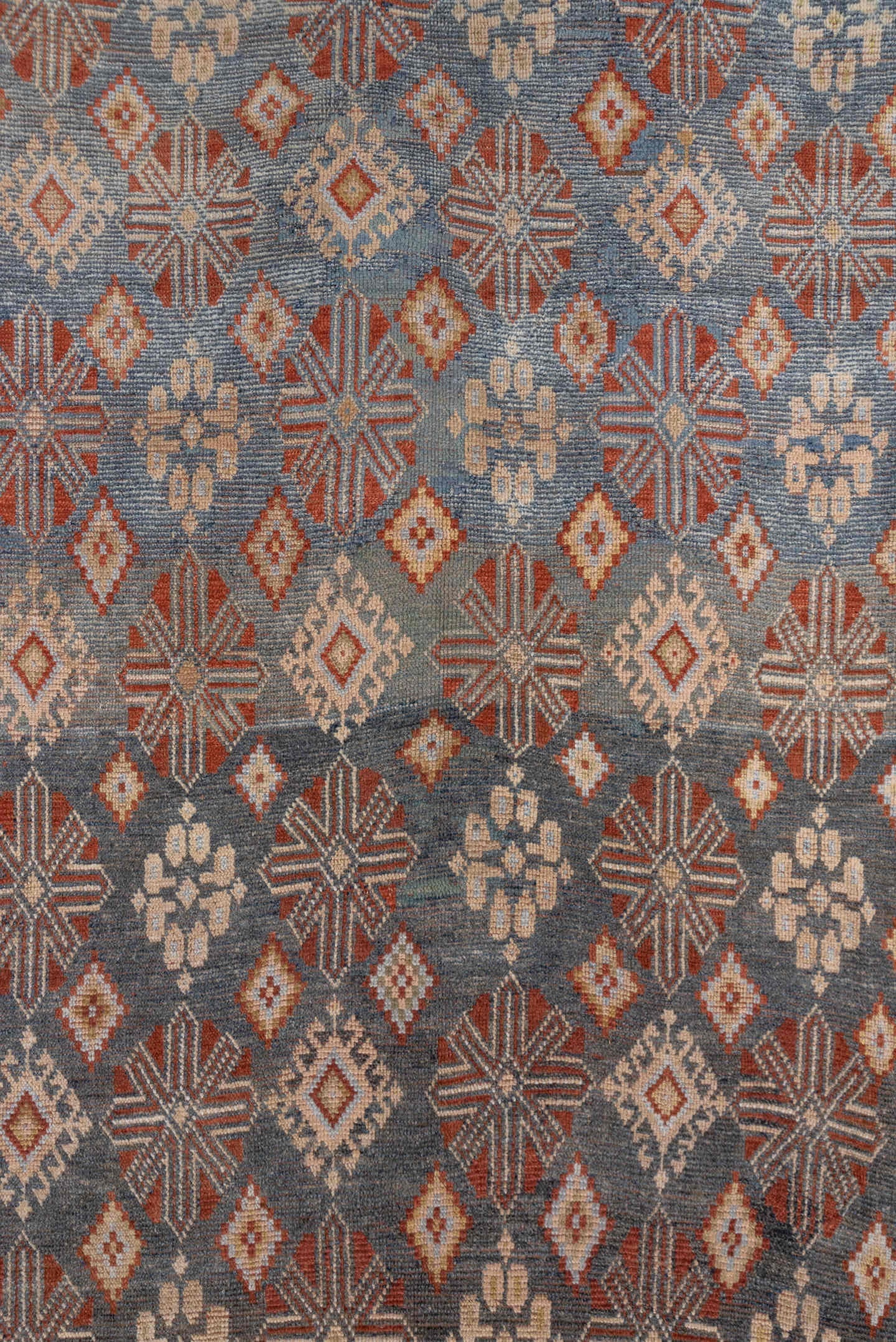 4' x 9' one-of-a-kind handmade antique Caucasian runner rug. Color palette: blue, ivory, rust, taupe, slate, camel