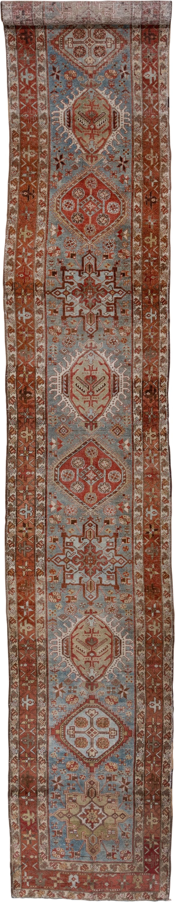 3' x 18' one-of-a-kind handmade antique Heriz runner rug. Color palette: rust, sky blue, ivory, brick, taupe, brown, slate