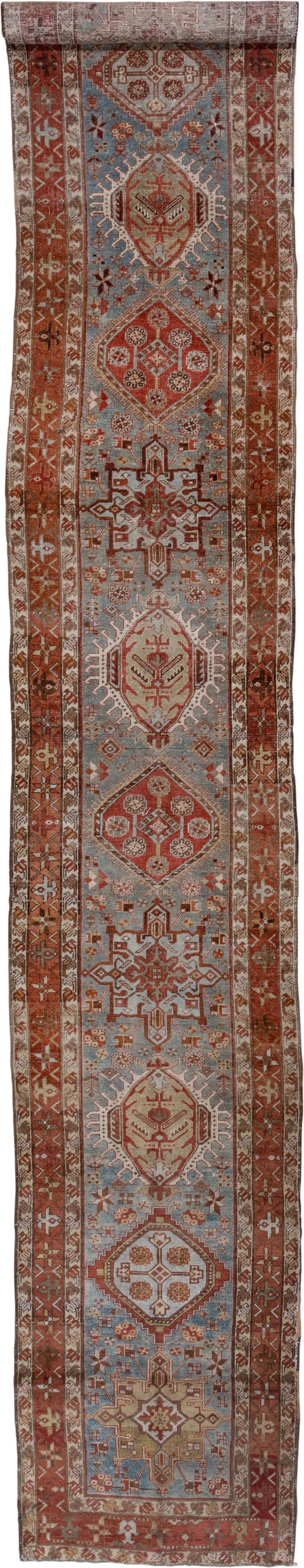 3' x 18' one-of-a-kind handmade antique Heriz runner rug. Color palette: rust, sky blue, ivory, brick, taupe, brown, slate