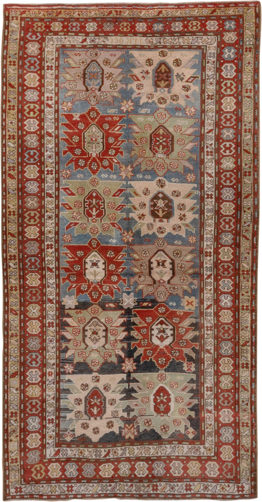 4' x 8' one-of-a-kind handmade antique Caucasian rug. Color palette: ivory, rust, brick, slate, sky_blue, camel, charcoal