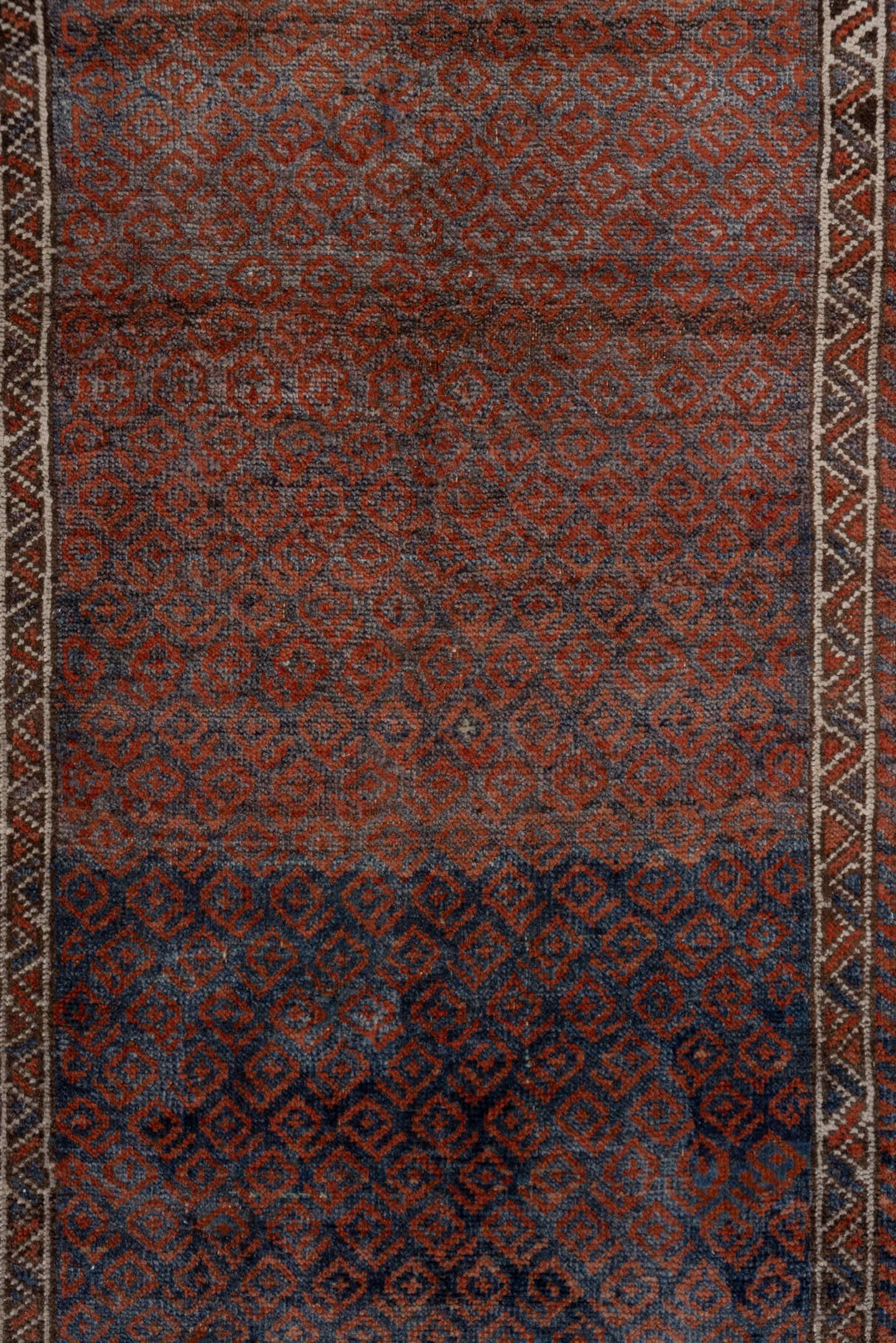 3' x 6' one-of-a-kind handmade antique Belouch small size rug. Color palette: rust, indigo, ivory, brown, charcoal