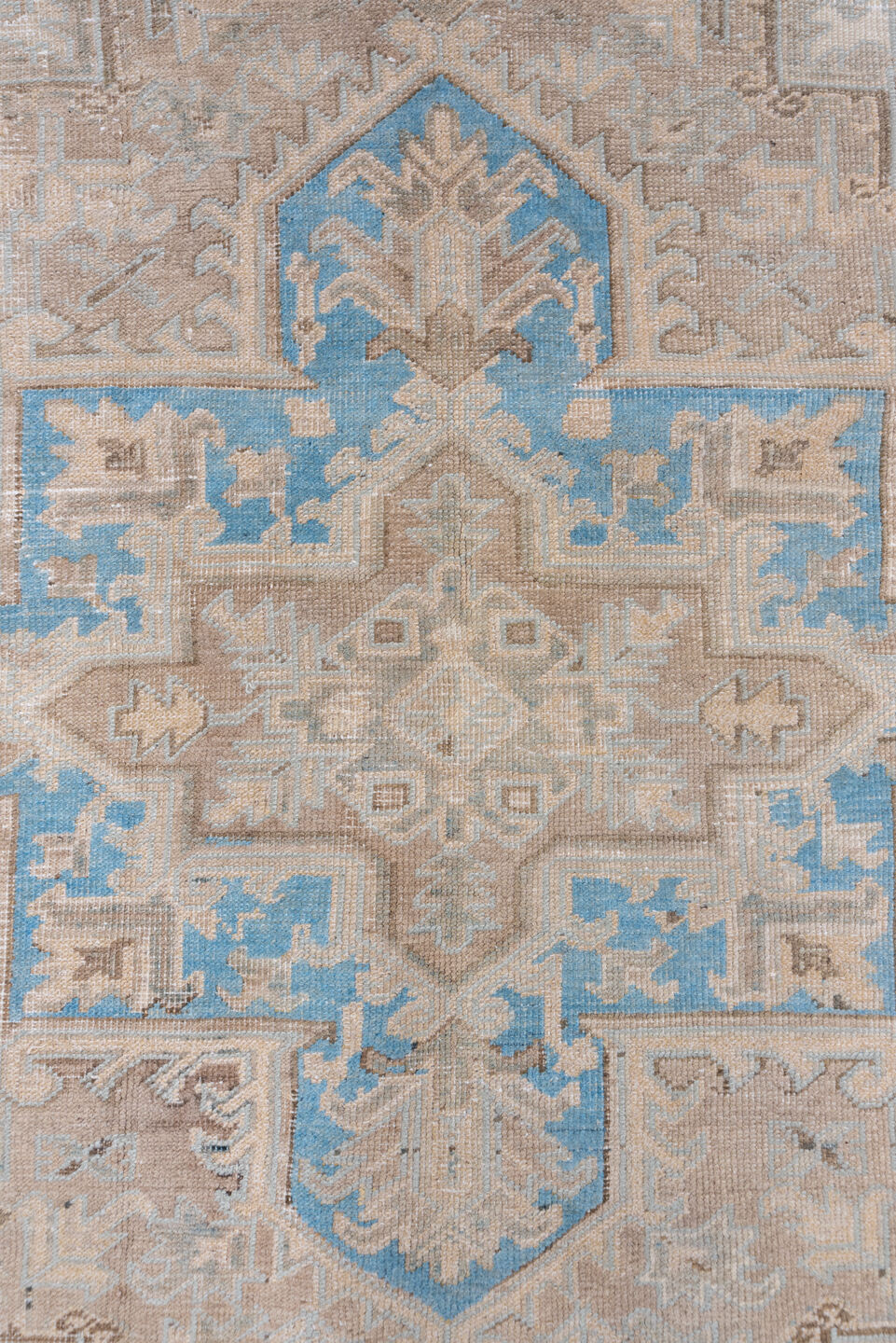 6' x 9' one-of-a-kind handmade antique Heriz medium size rug. Color palette: ivory, taupe, sky blue, beige, camel