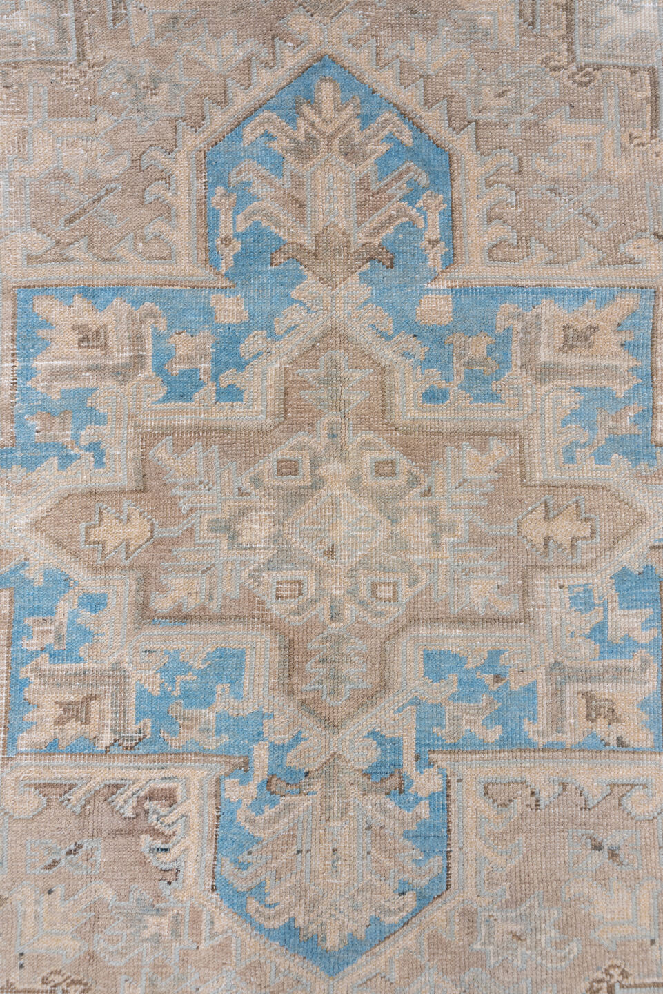 6' x 9' one-of-a-kind handmade antique Heriz medium size rug. Color palette: ivory, taupe, sky blue, beige, camel
