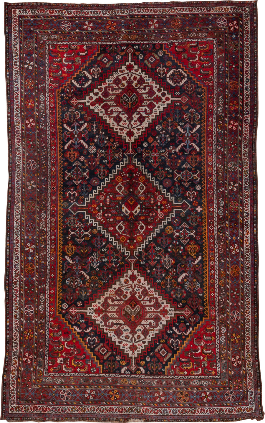 5' x 8' one-of-a-kind handmade antique Shiraz medium size rug. Color palette: red, navy, ivory, rust, burgundy, slate, gold