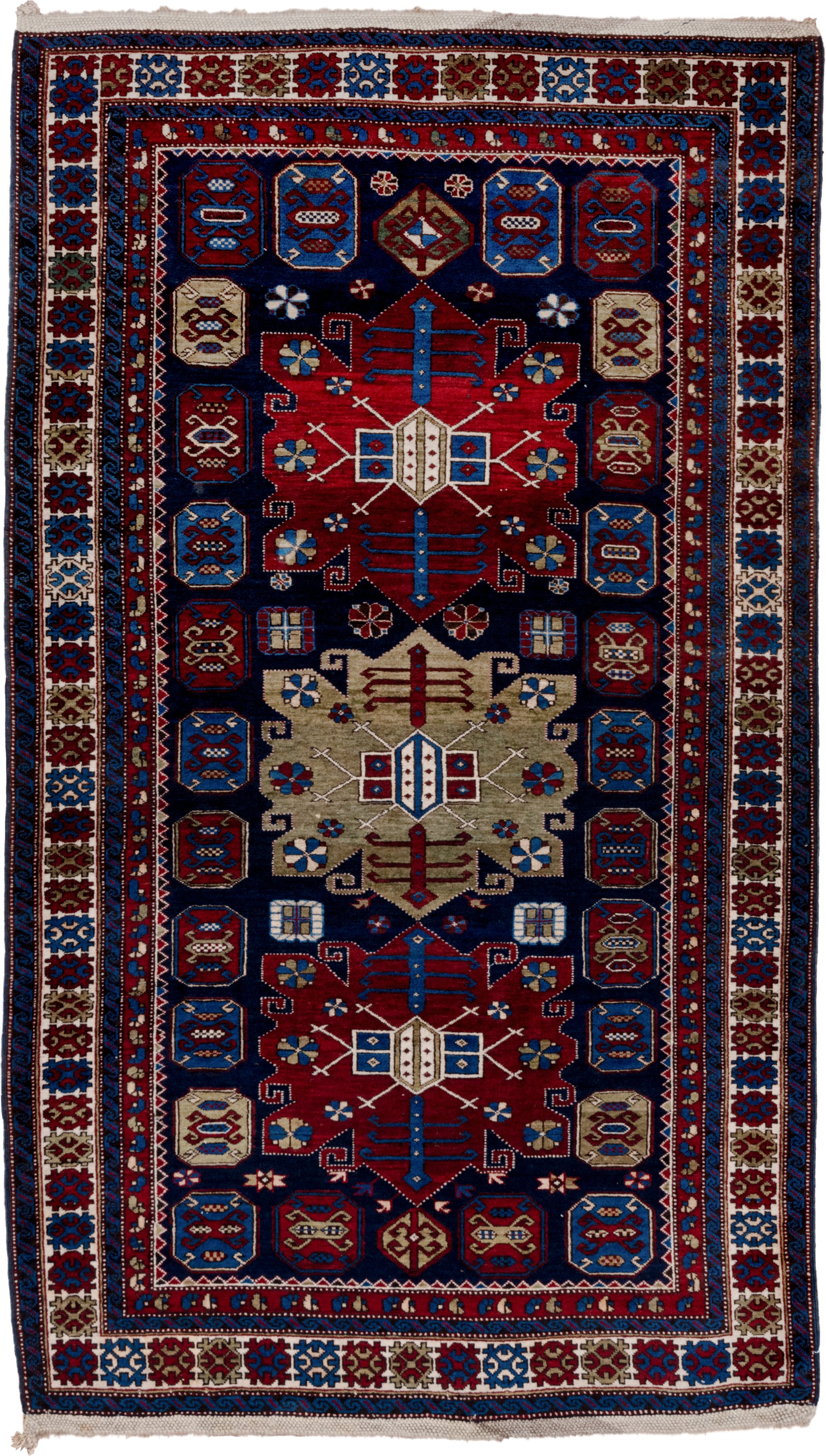 4' x 7' one-of-a-kind handmade antique Caucasian rug. Color palette: navy, crimson, ivory, cobalt, burgundy, camel, saffron