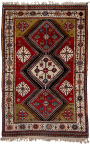 4' x 7' one-of-a-kind handmade vintage Qashqai rug. Color palette: crimson, ivory, indigo, camel, sky_blue, rust, black, red