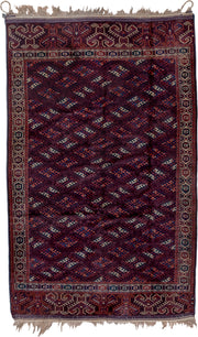 6' x 10' one-of-a-kind handmade vintage Yamoud large size rug. Color palette: burgundy, navy, rust, ivory, crimson, indigo
