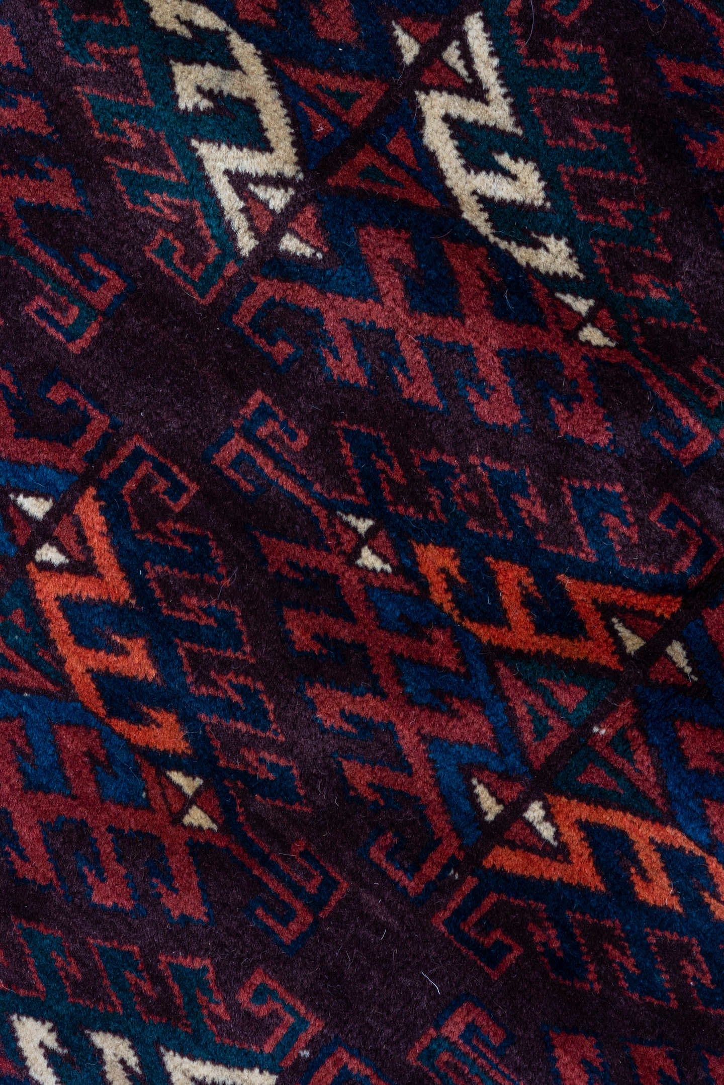 6' x 10' one-of-a-kind handmade vintage Yamoud large size rug. Color palette: burgundy, navy, rust, ivory, crimson, indigo