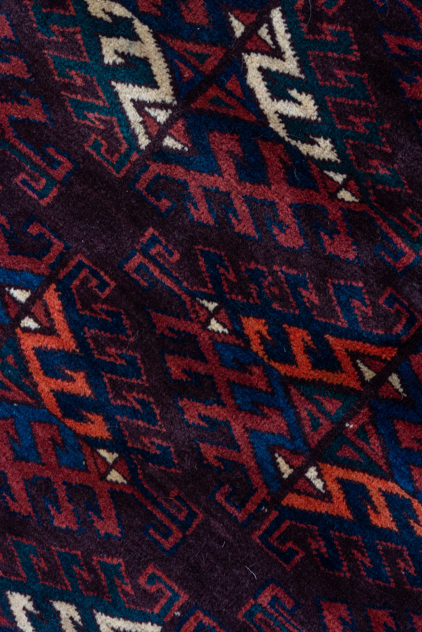 6' x 10' one-of-a-kind handmade vintage Yamoud large size rug. Color palette: burgundy, navy, rust, ivory, crimson, indigo