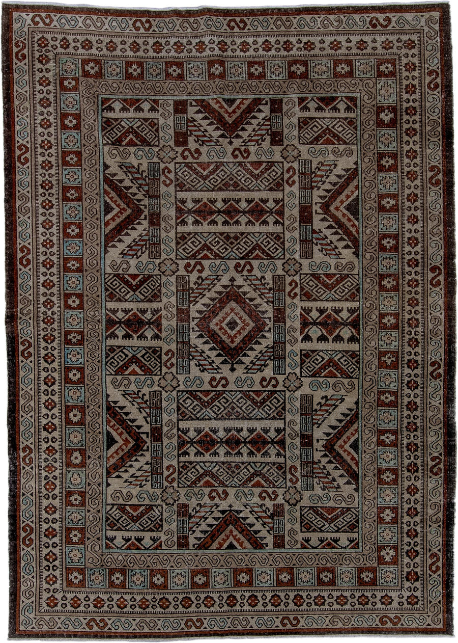 6' x 8' one-of-a-kind handmade antique Khotan medium size rug. Color palette: ivory, rust, brown, pale_blue, charcoal, taupe