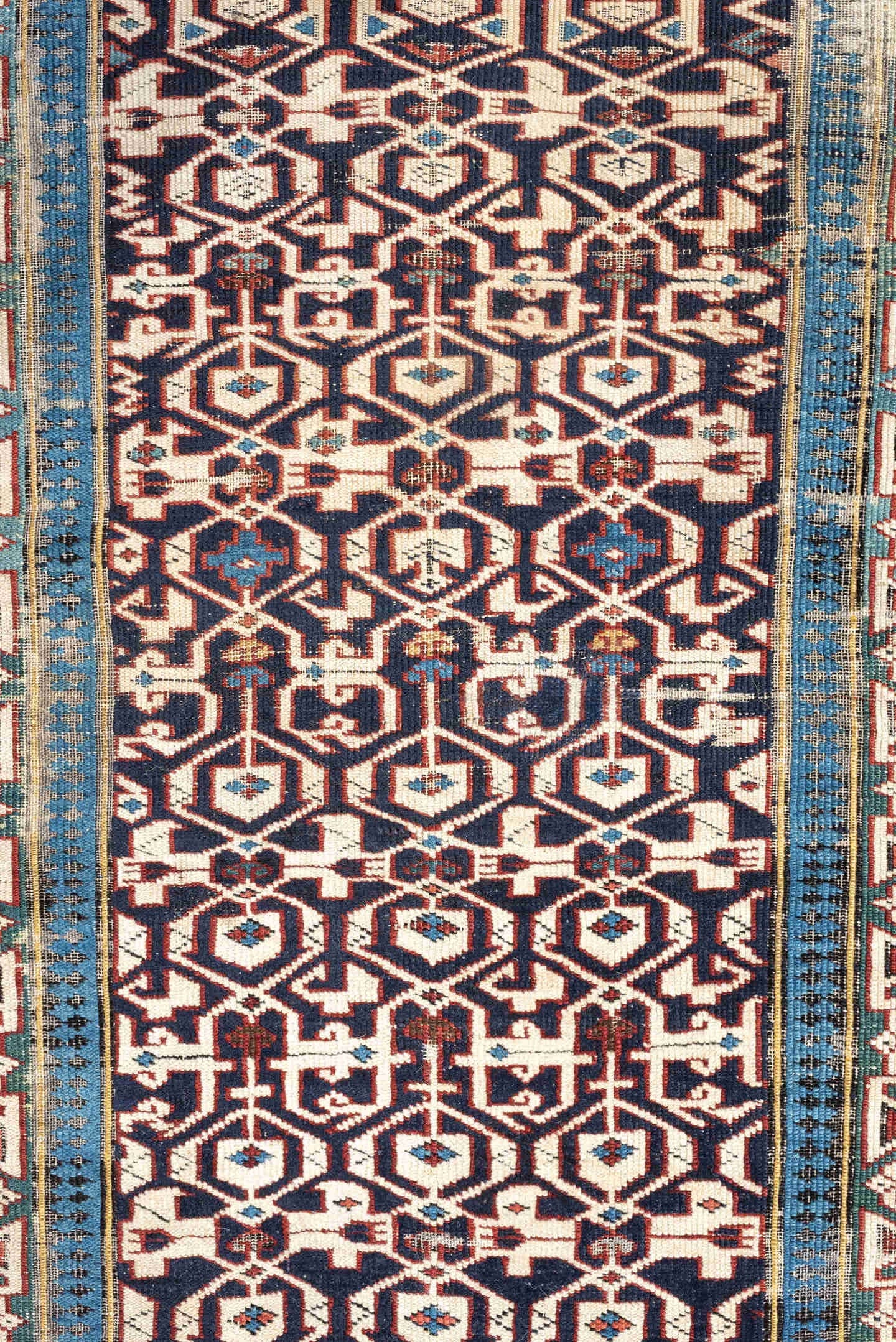 3' x 10' one-of-a-kind handmade antique Kuba runner rug. Color palette: indigo, ivory, rust, sky blue, camel, slate, purple