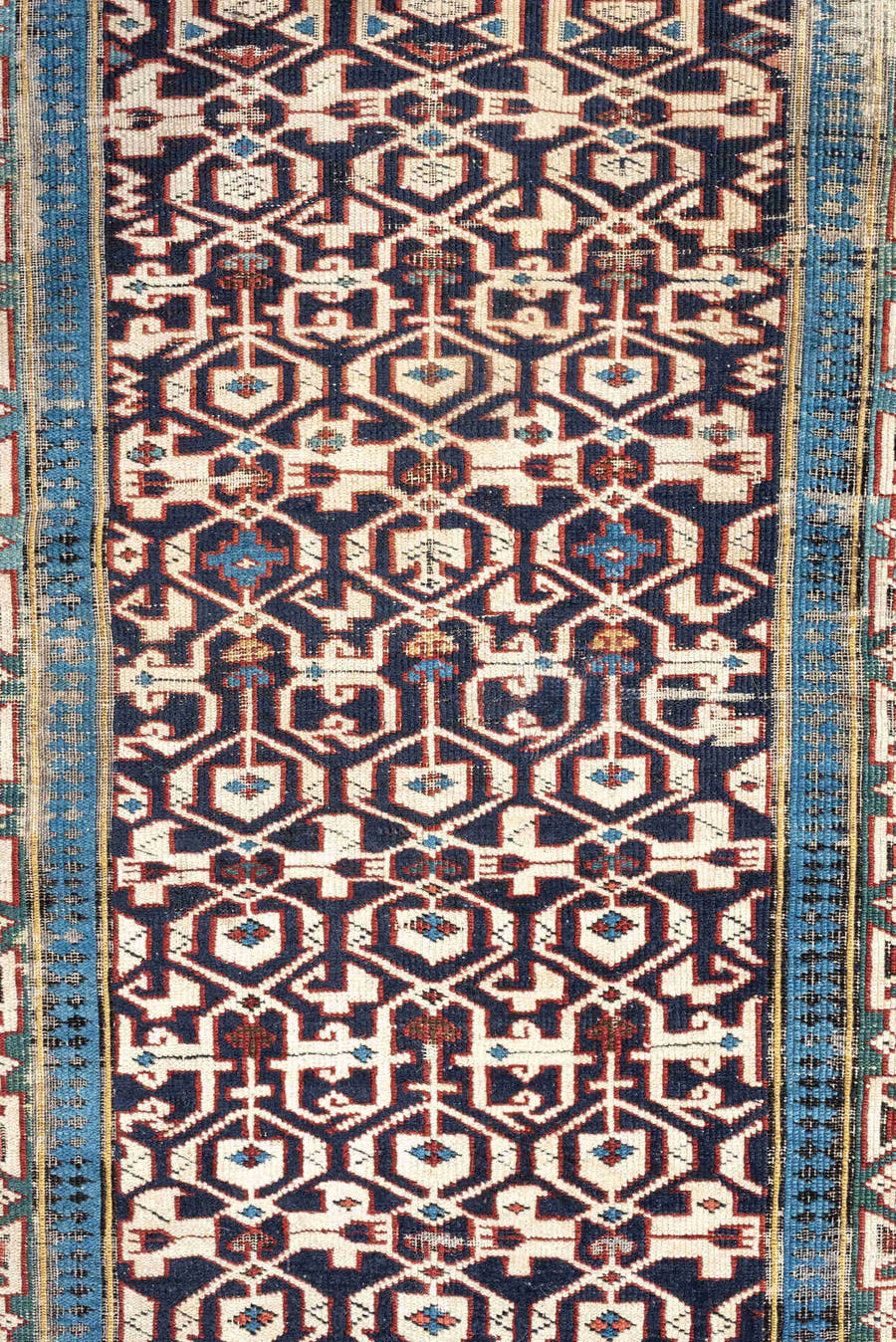 3' x 10' one-of-a-kind handmade antique Kuba runner rug. Color palette: indigo, ivory, rust, sky blue, camel, slate, purple