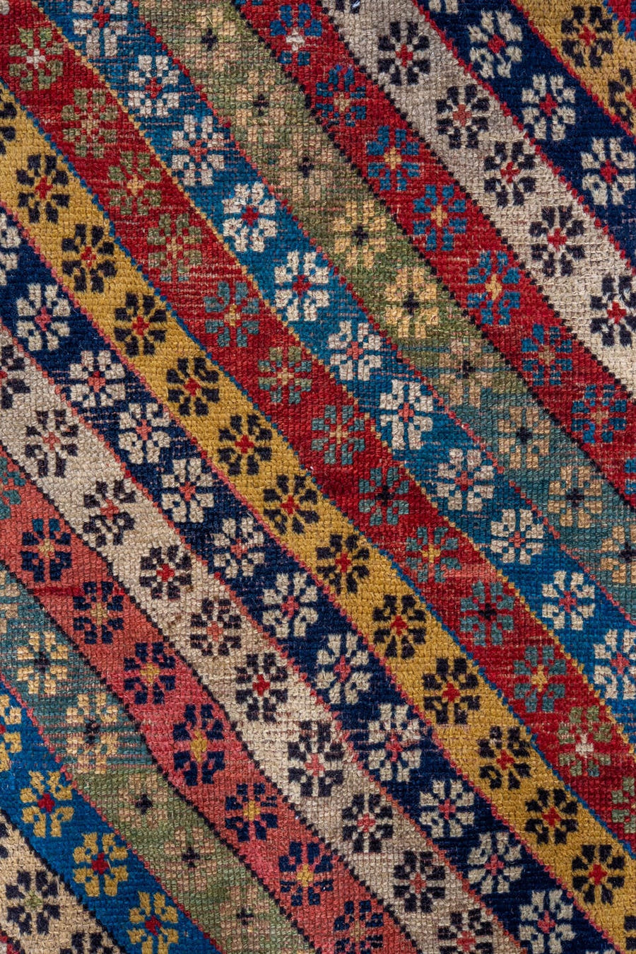 4' x 8' one-of-a-kind handmade antique Caucasian runner rug. Color palette: ivory, rust, indigo, camel, rose, navy, sage