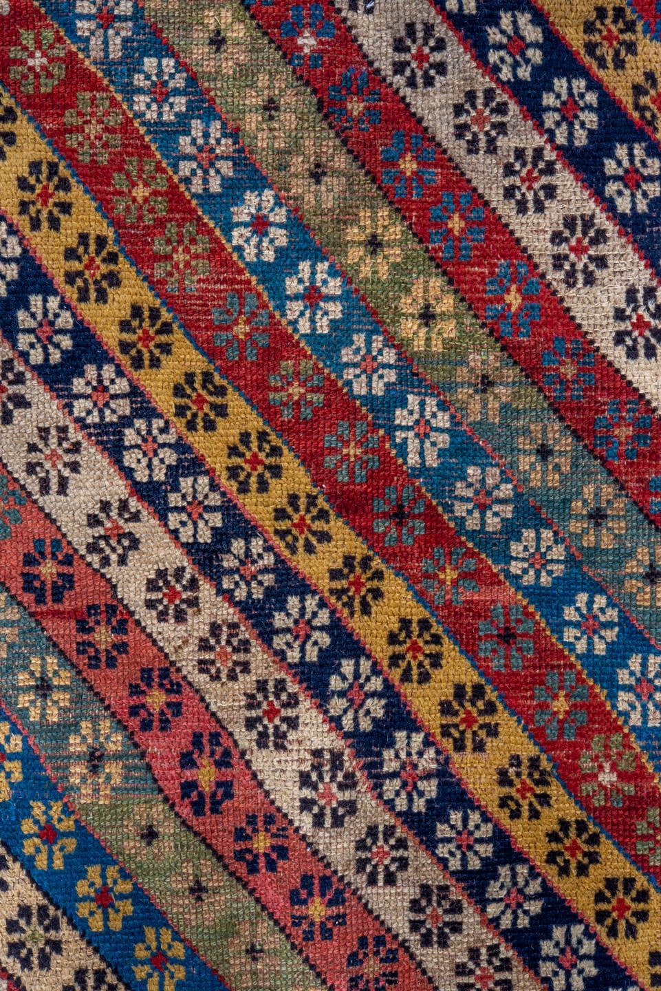 4' x 8' one-of-a-kind handmade antique Caucasian runner rug. Color palette: ivory, rust, indigo, camel, rose, navy, sage
