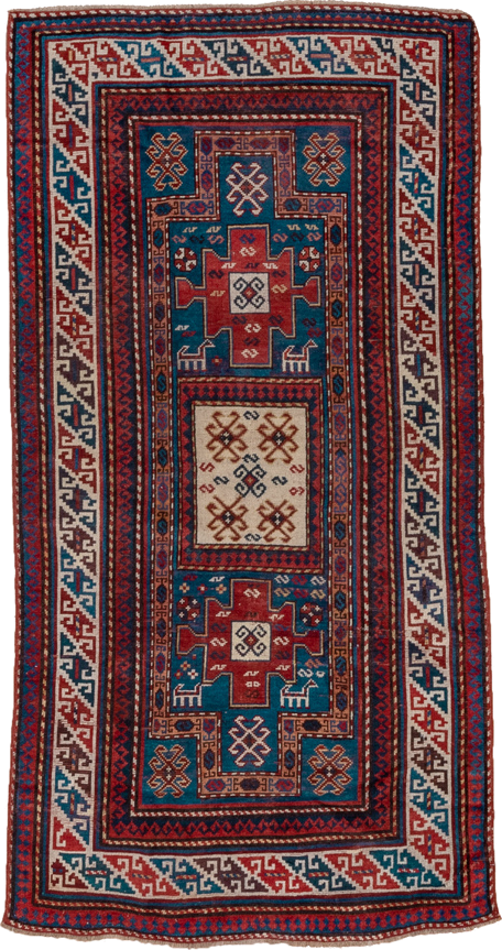 3' x 6' one-of-a-kind handmade antique Kazak runner rug. Color palette: blue, ivory, red, navy, rust, teal, brown