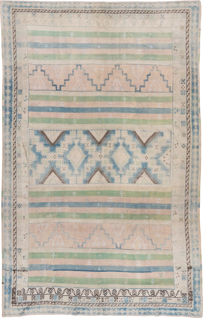 6' x 9' one-of-a-kind handmade antique Moroccan medium size rug. Color palette: ivory, pale blue, sage, blush, taupe, brown